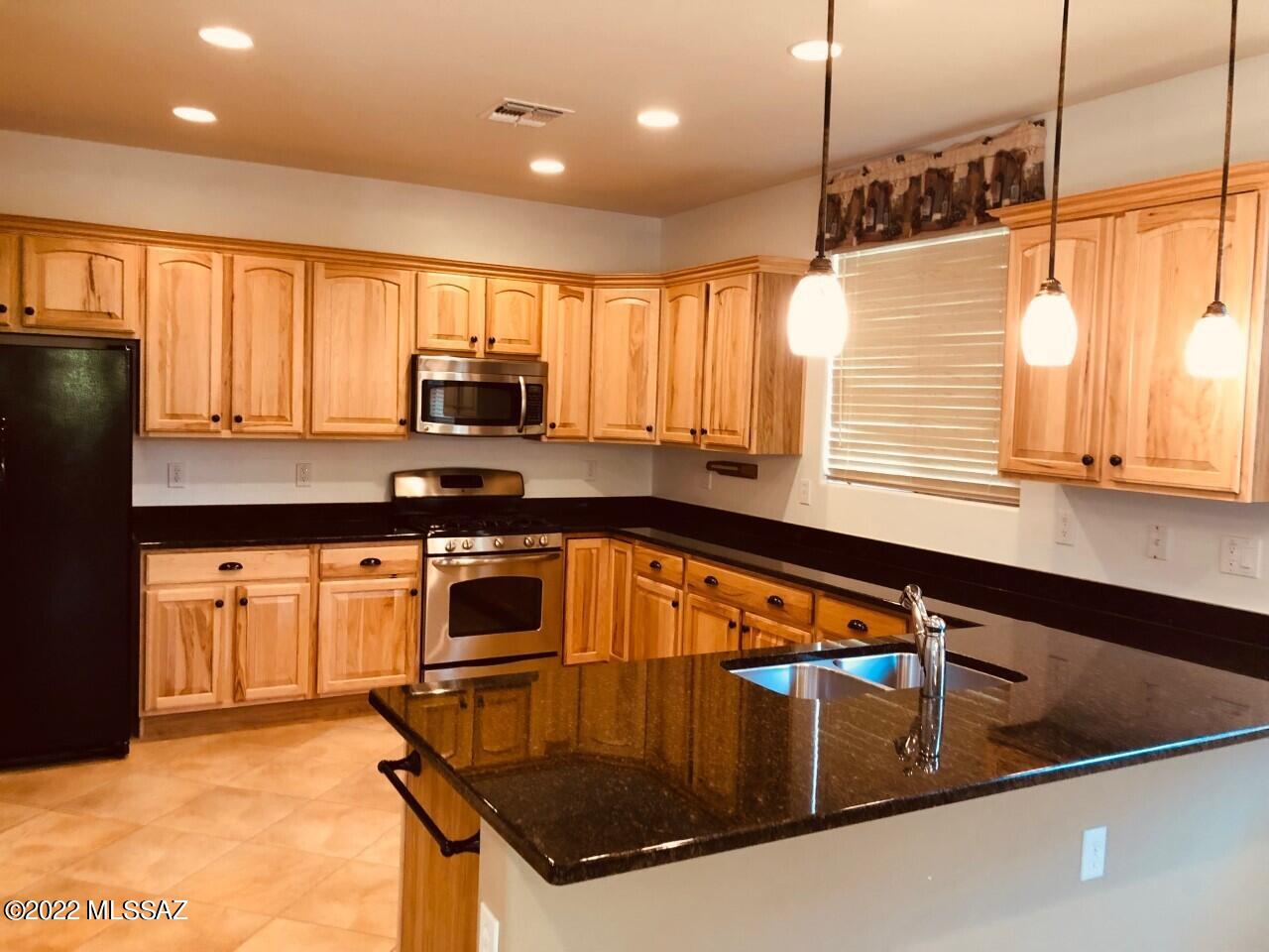 Beautiful Spacious like new home located in 55+ community of Del Webb at Rancho del Lago adjacent to one of the nicest golf courses in Southern Arizona.This wonderful home has an awesome kitchen w/upgraded hickory cabinets, granite countertops, & breakfast bar.Master Suite has 2 closets & a super bathroom w/separate tub & shower. Dual Vanities,& Makeup/Prep Area.Plantation shutters.Extended Garage. Great Laundry room w/cabs & utility sink.Backyard is private & beautiful.Lots to do in this active adult community including but not limited to Pickle,Tennis & Bocce ball.Newly installed chipping & putting area,2 heated swimming pools,incredible fitness room,internet cafe, library,craft room gourmet commuity kitchen,dance / aerobic room.massage area, poker & puzzle tables.You'll love this one !