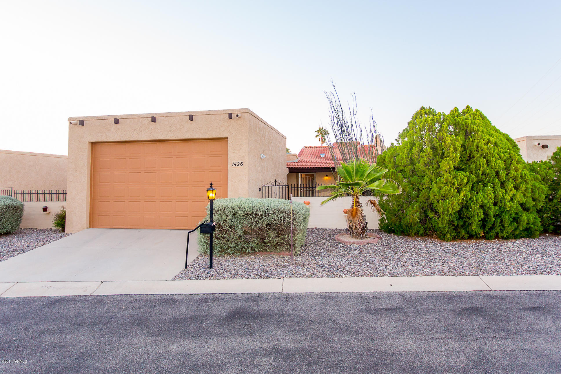 Fantastic Location, Popular Las Quintas neighborhood features beautiful community pool and extra parking spacing in front of this unit for your guests. Spacious three bedroom home has wonderful gated courtyard, expanded north facing covered patio and walled backyard for privacy and outdoor enjoyment.  Fabulous OVERSIZED GARAGE with Extra Height and Length that can accommodate large trucks or a small RV.  Sprawling great room flows nicely for entertaining with soaring ceiling and dramatic skylight feature above dining area.  Most kitchen appliances new in 2016. Each Bedroom has sliding glass doors that lead onto patios. Master bathroom is huge!  Location, location, location!  Close to shopping, dining, entertainment and services!