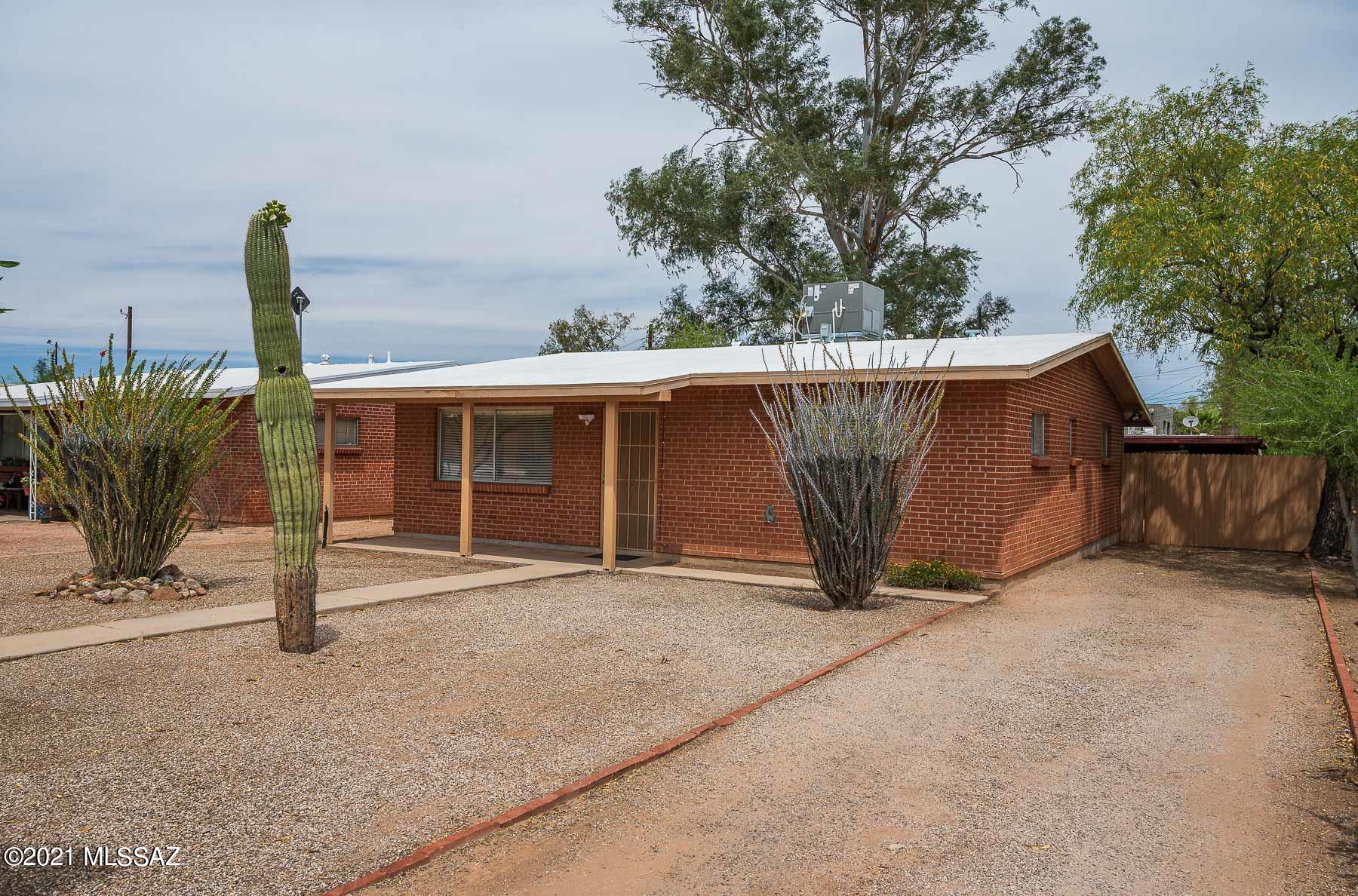 LOCATION, LOCATION, LOCATION! Nestled in the historic district of Blenman Elm, this mid-century house is in the desirable heart of Tucson with no HOA and mountain views! Located just minutes from Banner Hospital, the University of Arizona & Restaurants! This must see gem boast of plenty of natural light, a large kitchen, large bedrooms, 2 full remodeled bathrooms, plenty of storage room, new A/C w/ WiFi thermostat w/maint. warranty , gas, dual pane windows, roof 3-4 yrs old . Enjoy the large patio covered backyard all year long as this house has a North/South orientation. Plenty of parking with a carport!