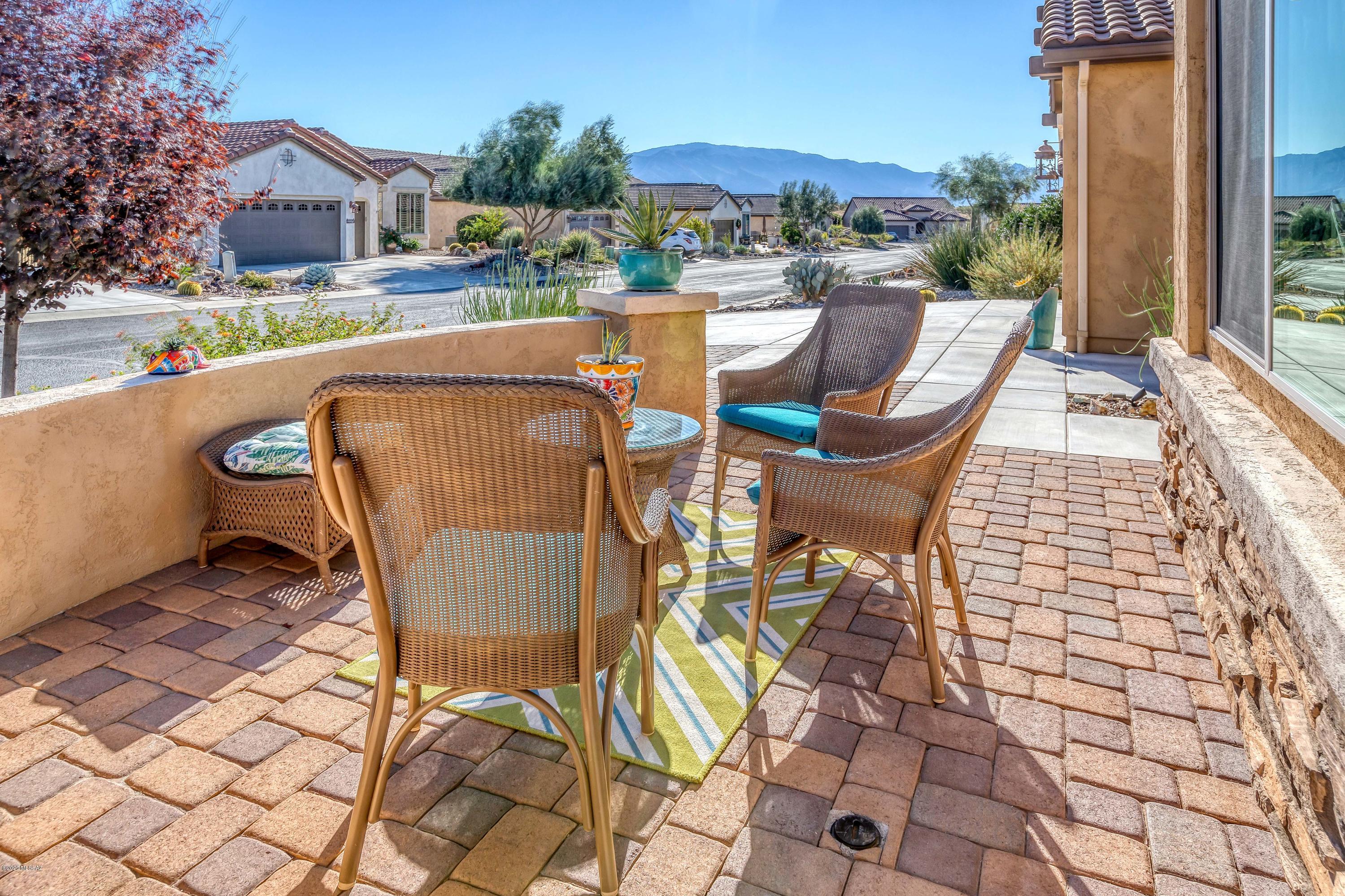 Immaculate, Expanded Hermosa Model with Den in a Peaceful Setting. Mountain Views from the paved front courtyard and back patio. Bright Kitchen with Gorgeous Granite Counters, Europe Beech Cabinets, Stainless Appliances, Center Island with Breakfast Bar. Dining Area Accommodates a Large Table for Entertaining. Open Great Room with Gorgeous 20 Inch Tile Flooring. Master Suite with Walk-in Closet. Elegant Master Bath with Quartz Counters & Double Sink Vanity. Comfortable Expanded Guest Room, Split Bedroom Floor Plan for Privacy. Den & Laundry Room with Cabinets. 4' Extended 2-Car Garage with Golf Cart Garage. Outdoor Living Space with a view of the Sunsets over the Tortolita Mountains. Meticulous Move-in Condition. Start enjoying all that SaddleBrooke Ranch has to offer!