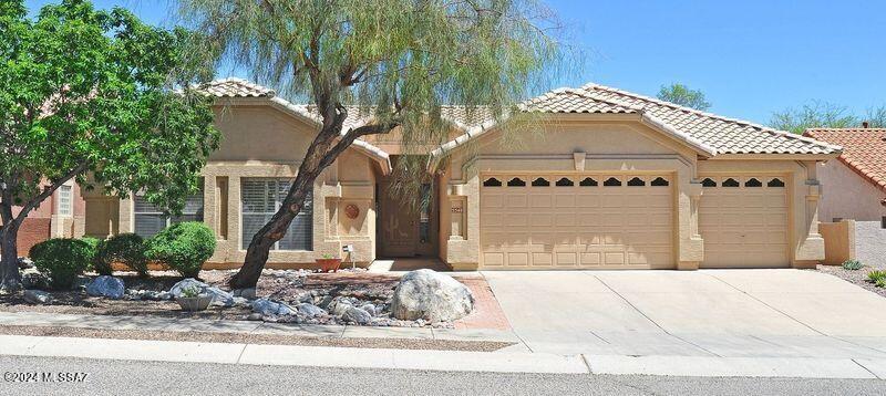 A great opportunity to own a home in the desired Villages of Ventana, located in the Catalina Foothills School District 16. It is one of the larger homes in the development, with spacious 4 BR plus den/office and a 3-car garage. The home features vaulted ceilings, decorator arches, and engineered wood flooring in traffic areas. Large upgraded kitchen with island, granite countertops, and breakfast nook. Spacious family room off the kitchen with surround sound and built-in entertainment center. Separate living and formal dining rooms. The primary bedroom, featuring a bay window and sliding door to a patio. The primary bathroom has been remodeled with a quartz countertop, double vanity, large garden tub, and a separate walk-in shower with quartz walls and bench, as well as instant-on hot water and a large walke-in closet. One of the bedrooms has a Murphy bed with a desk. Plantation shutters in primary and front bedrooms. Beautifully landscaped backyard with a full-size brick paved patio. Close to Sabino Canyon Recreation area, golf at Ventana Resort, schools, many restaurants, and grocery shopping.