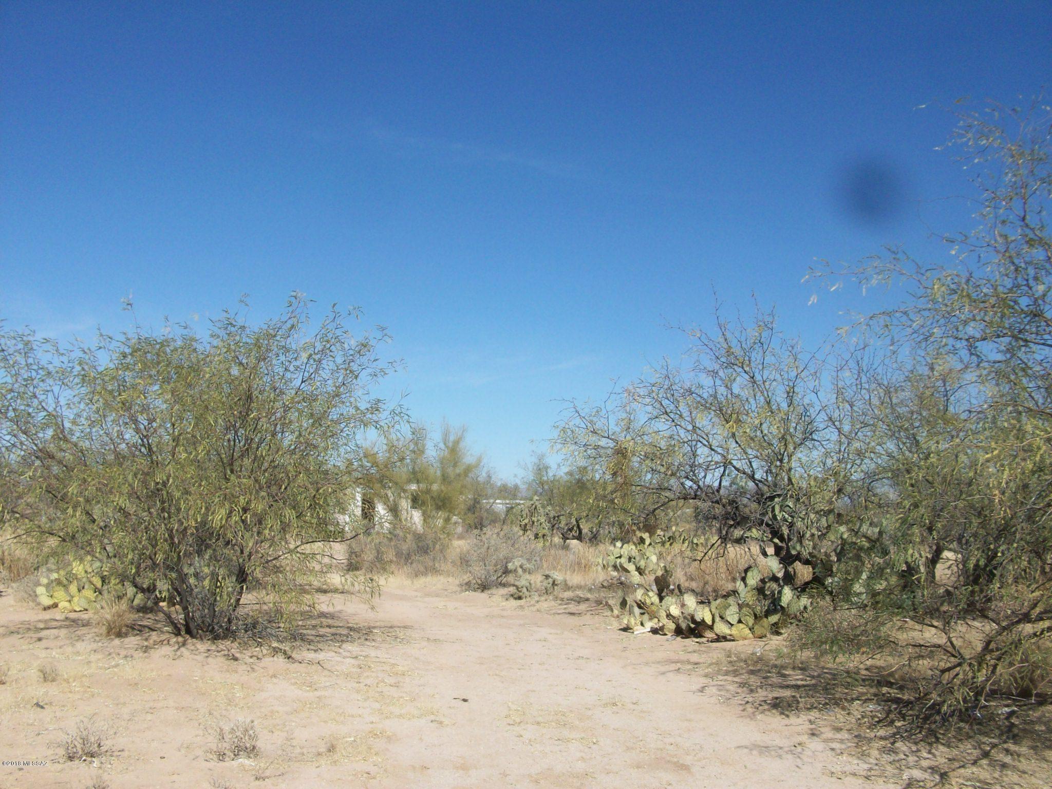 Fenced acre lot - older mobile (not affixed) Septic, water and electric - great spot for new home - site built or Manufactured - great price for the area.