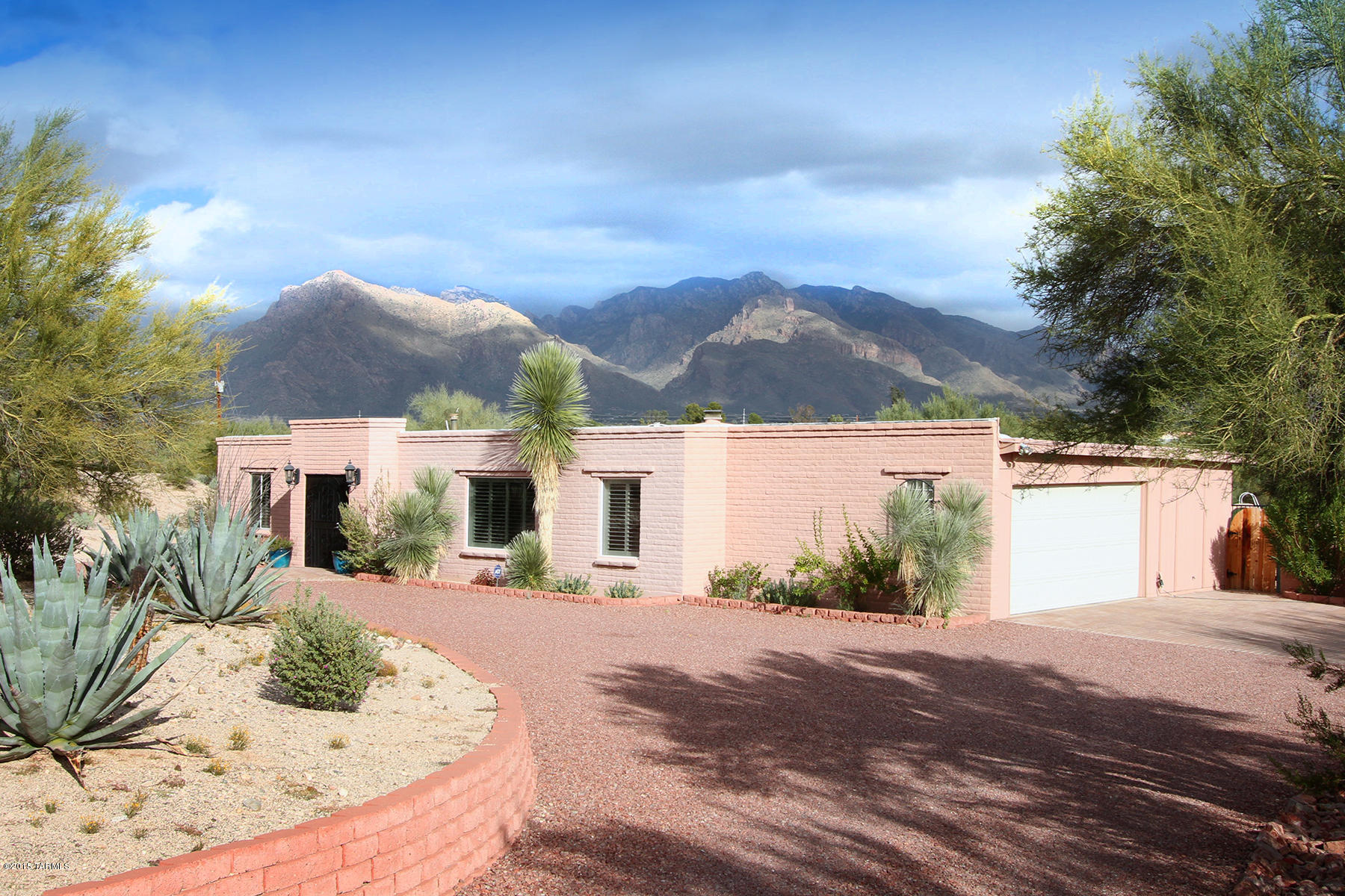 Fabulous Remodeled 4 Bed/2.5 Bath on Gorgeous .6 Acre Lot w/ Mountain Views!! Very Private, Backs to Wash.  Circular Drive Leads to Nice Entrance to Home Boasting Open Floor Plan, Family Room off Kitchen, Formal Living & Dining Rooms, Updated Open Kitchen, Updated Baths, Breakfast Bar, Nice Large Laundry Room, Upgraded Lighting, Custom Fans, Fixtures & Paint, Gas Assisted Fireplace, Skylights Through Out,  Shutters, Tile & Wood laminate Flooring. Spectacular Yard  w/ Lots of Room for Entertaining & your Family. Artificial Grass, 2 Brick Seating Areas, XL Covered Patio, Fenced Pool. Storage Room + More Storage! Extra large 2 Car Garage. Walk to Schools. Near Shopping & Recreation. WELCOME HOME!
