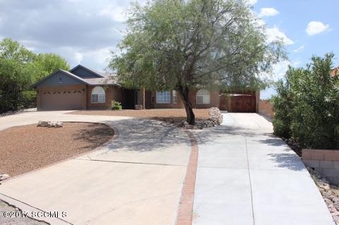 Let's talk about a complete package deal. Perfectly situated to enjoy magnificent views of the nearby mnts. This home was built w/many stylish upgrades throughout incl. a custom blt kitchen w/SS appliances. Spacious bedrooms including a MB w/an oversized walkin closet & garden tub. Relax in the privacy of your own rear yard. A great gathering place for family & friends. Covered patio,grass area & play equipment included. Plus an extra area w/bathroom facility to use as a workshop,gym or office. This home includes many additional features such as tile and laminate flooring, vaulted ceilings, bay window, surround speakers, alarm system, skylights, dual pane windows, circular driveway, RV space or space for two car carport. Great attention to detail. This is a perfect home for  entertaining inside and out!