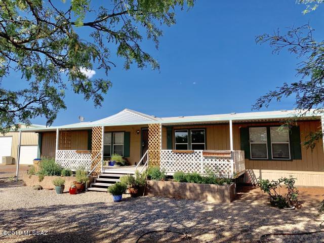 Wonderfully spacious 4bd 2ba on 4.69AC of Horse Property includes a HUMONGOUS 40 X 50 GARAGE WORKSHOP insulated and has a
temperature controlled room perfect for an office or hobby and crafts. The home has a large living area and a formal dining room. Huge eat in island kitchen with tons
of storage and counter space. Huge master bedroom suite. New Beautiful bamboo flooring in most of the rooms and extra material to finish it off. Wrap around
Covered patio area on 3/4's of the home. Completely fenced and cross fenced yard includes a chicken coop area too! Beautiful nature landscaping attracting a variety
of wildlife species for your enjoyment. Serene pond and water feature to complete the natural ambiance.