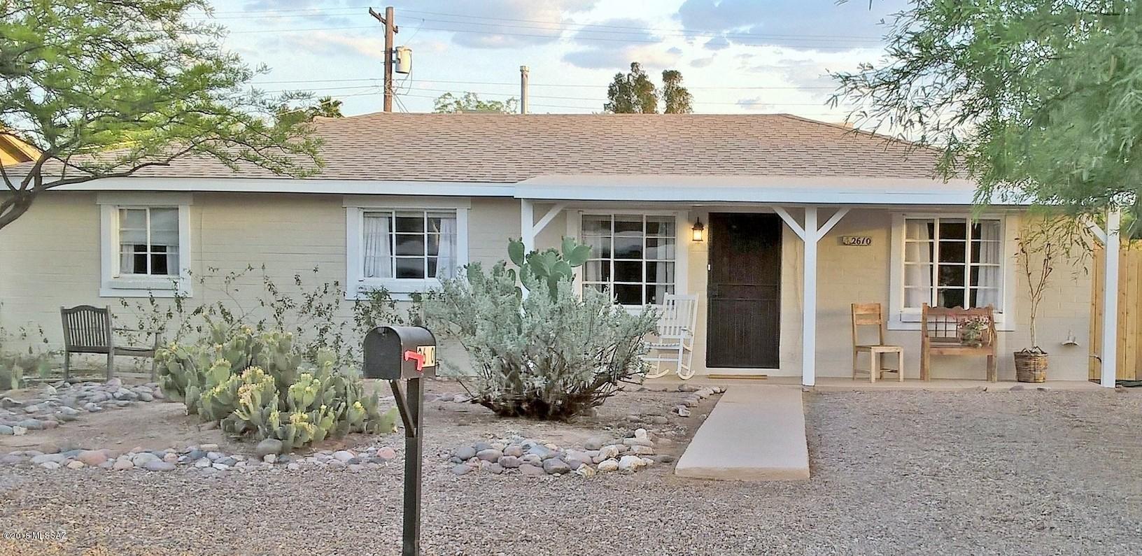 A warm and inviting 4-BD 2-BA Home! An Oasis near Everything Central! Univ of AZ, UMC, Downtown! Lovingly Remodeled, Updated while Keeping Its Historic Charm! Custom French Doors! Lovely Pergo, Tile Throughout! Kitchen, Beautifully Remodeled, w/Gas Range, Fridge, Dishwasher, Disposal! Spacious Bedrooms include Master w/Separate Entrance, Lg BA w/Dual Sinks, Lg Walk-in Shower! Central A/C w/ceiling fans; Gas Heat! Lovely Covered Patios, Front and Back, Look Out on Beautiful, Low-Care Landscaping! Lovely Custom Block Wall! Inspiring Mtn Views from Nearly Every Room! Within home, Spacious Laundry Rm and Lg Storage Rm, not included in SQ FT! Lg Tuff Shed! Newer Roof! All Appliances Stay! One-Yr Home Warranty! A Warm and Inviting 4-BD, 2-BA Central Home -- Move-In Ready!