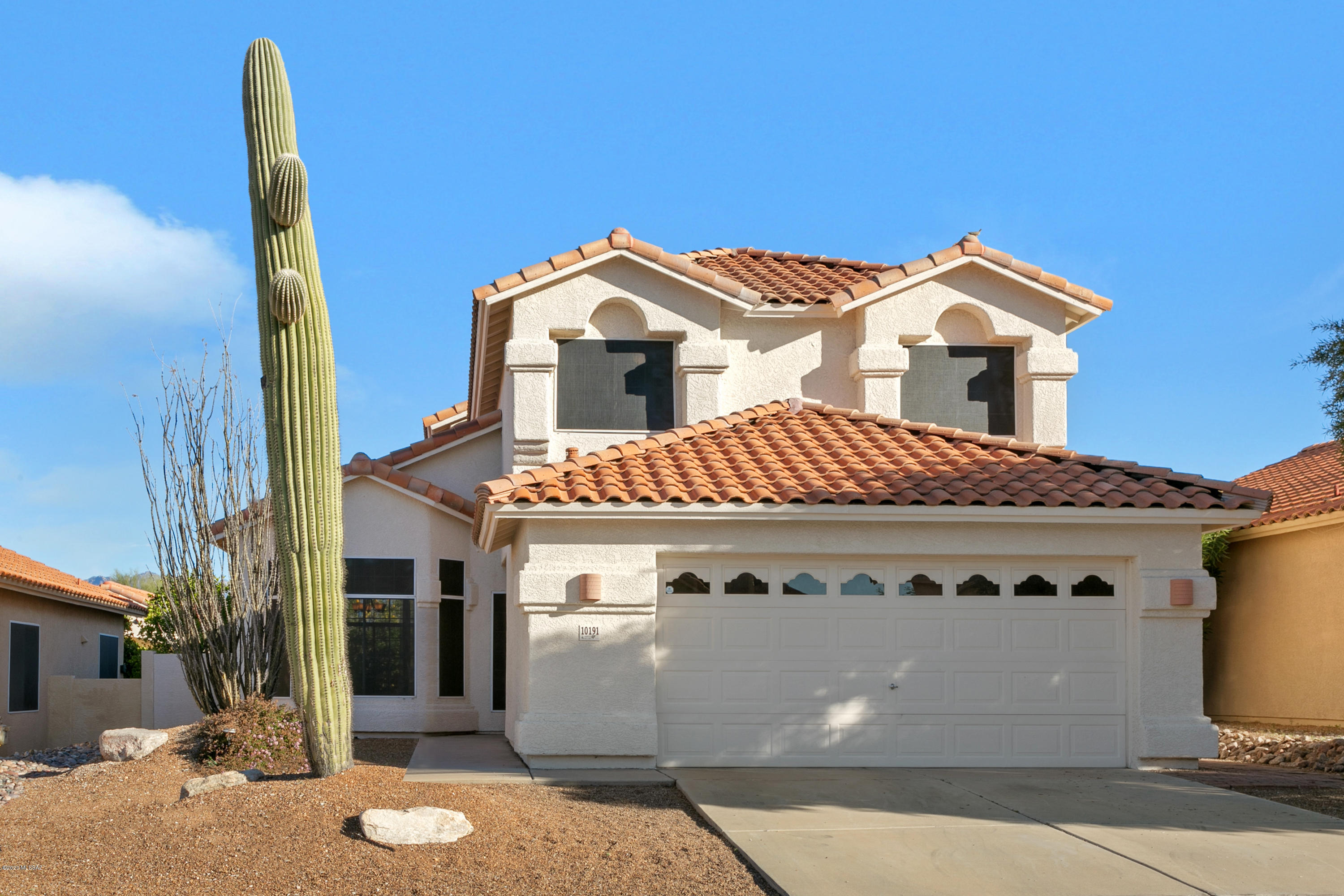 Located near Broadway/Houghton, this Sonoran Heights home features a lush back yard, mountain views and tasteful upgrades!  Tile downstairs except for one bedroom.  Full bath downstairs too!  Upstairs the spacious master boasts a beautiful master bath and that view from teh balcony!  Wow!  2 more bedrooms up and another bath.  New carpet just installed, sun screens to bring in light but without glaring!  Definitely want to check this one out!