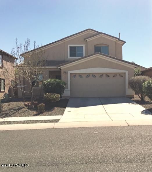 Outstanding home in the award winning community of Rancho Sahuarita. This 4 bedroom/3 bath home offers multiple configurations for your family's needs. A full bedroom and bath are downstairs, and 2 bedrooms + the master upstairs. In addition the home has a formal living and dinning, plus a spacious and open kitchen and family room. Tile in the kitchen, and beautiful engineered wood flooring in the family room. Outside the home offers an ample yard and covered porch. The extended 2 car garage provides extra storage space for your things. A large community park and pool are right around the corner to enjoy all the outdoor activities found in sunny AZ! With a quick commute to downtown Tucson, this is resort living at an affordable price!