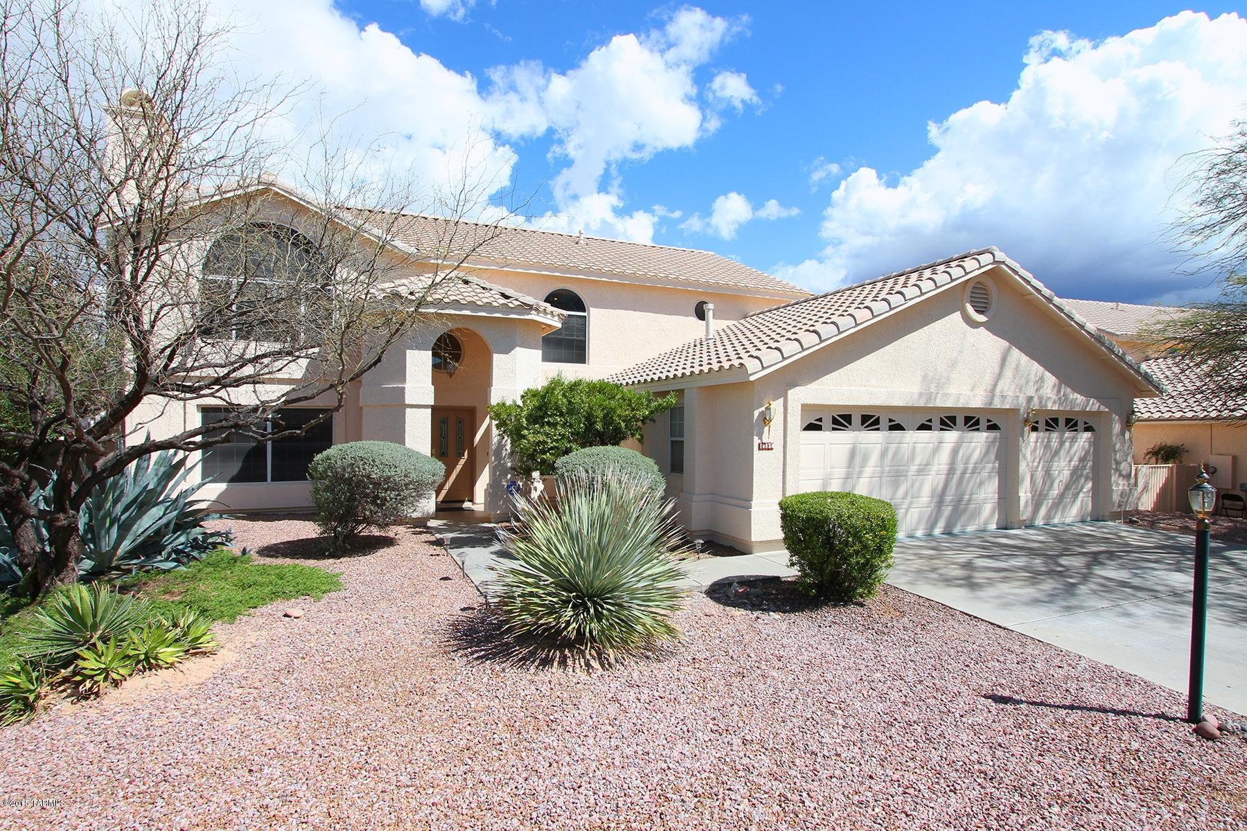 This spacious popular two-story Tempe floor plan has recently been re-painted inside/outside and updated w/new carpet and window coverings throughout. This home offers Pergo wood floors in dining room/living room and 4 large bedrooms on second level with generous size loft. Visitors will enjoy their stay in first floor guest quarters w/private bath. 6th bedroom on first floor is currently used as an office. Kitchen boasts gas range and double ovens leading to formal dining and living areas.  Entertain family & friends on covered patio with views of Catalina Mountains from back yard featuring Pebble Tec pool/spa with adjoining grassy area. LOCATION,LOCATION,LOCATION...close to shopping,golf and restaurants. A MUST SEE!