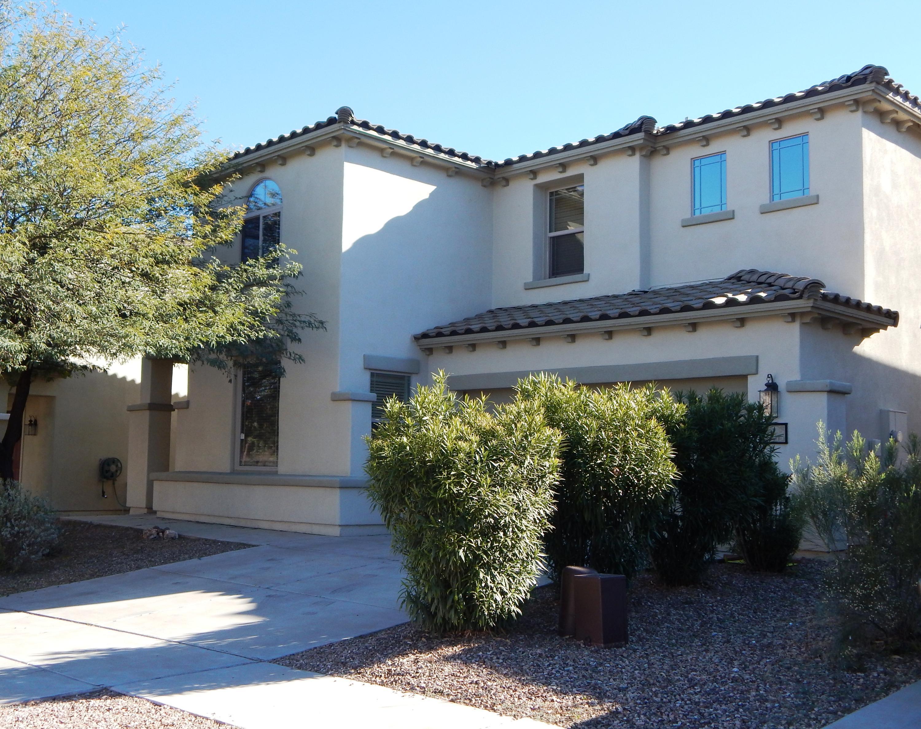 This single family home is 2221 Sq.' with 4 bedrooms, 2.5 baths and a second floor laundry room. The front living area is spacious and leads to the homes central dining area. The kitchen and family room are an open concept with beautiful neutral tile and sleek black appliances. The kitchen also offers visibility to the dining area through a large arched opening. The dinging area is light and bright with backyard access through a sliding door. The easy care backyard has a large extended patio and dog kennel. The four bedrooms are each unique adding character to the second floor. This great home is located in the popular community of Rancho Sahuarita. The community has many amenities to offer such as pools, walking paths, exercise room, club house and so much more.
