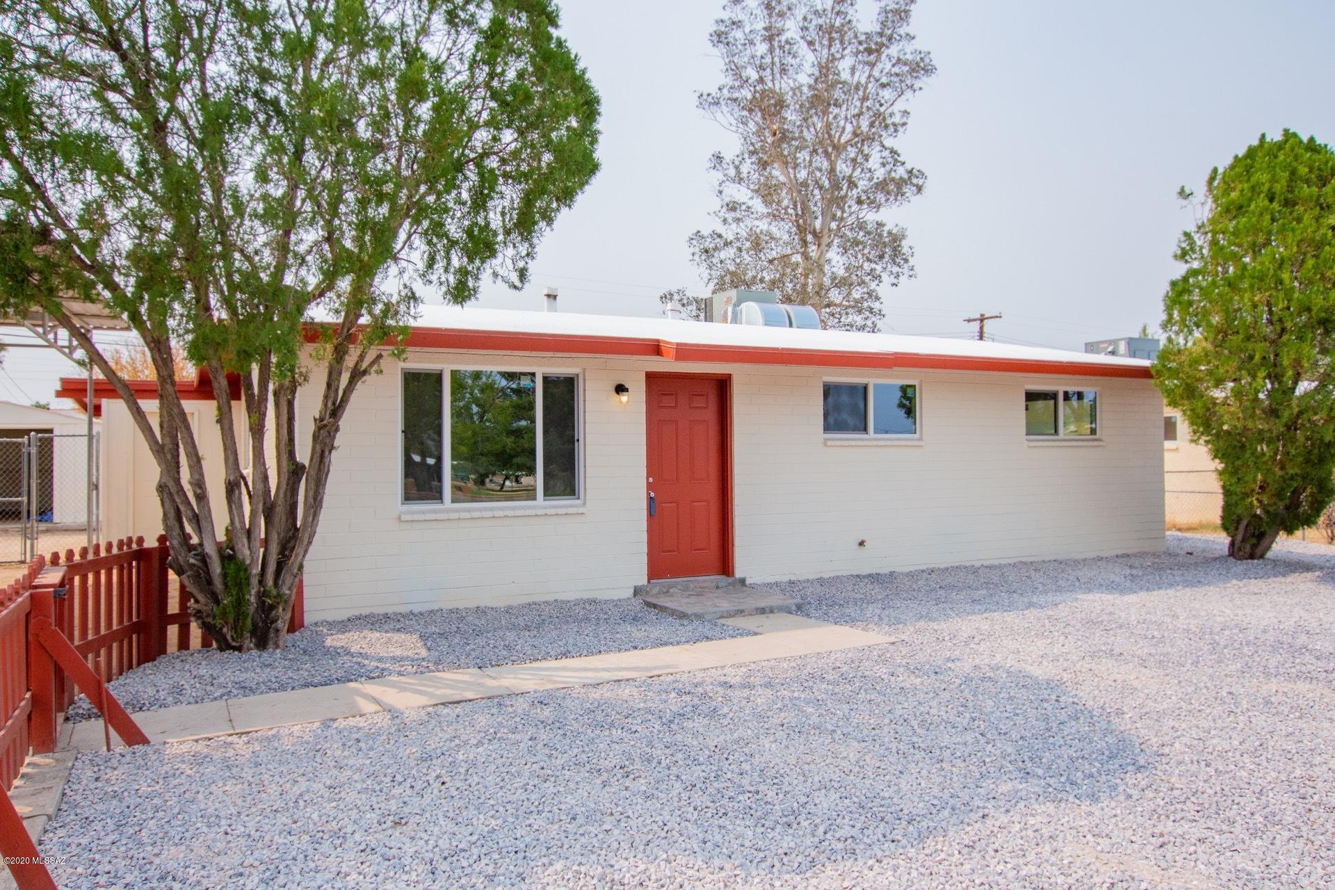 Here is your opportunity to live in this ready to move in and centrally located 4 bedroom, 2 bath updated home with new dual pane windows, 2 HVAC units, updated baths, new tile and carpet flooring, updated bathrooms, new stove and more.  This 1294-sf home can have the 4th bedroom used as a guest quarters with its own private entry.  You have a park across the street, shopping, restaurants, the base and more just minutes away.  Easy ride to the University. You have lots of room to park you cars, store your RV, toys and more.