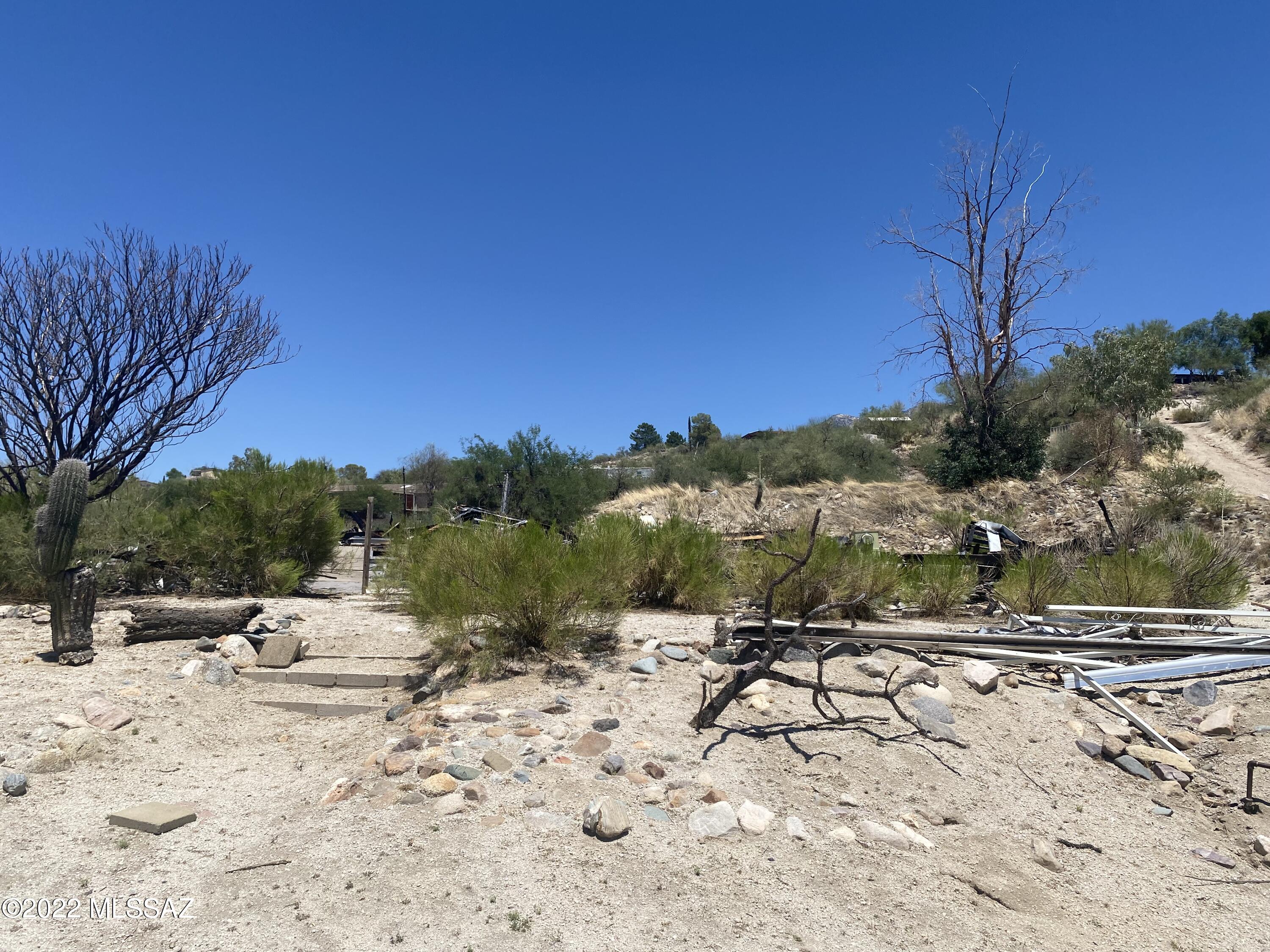 High sunset view lot not far off a paved road.  Zoning allows for manufactured home or site built. Septic  installed, condition unknown.  Property is being sold as is.