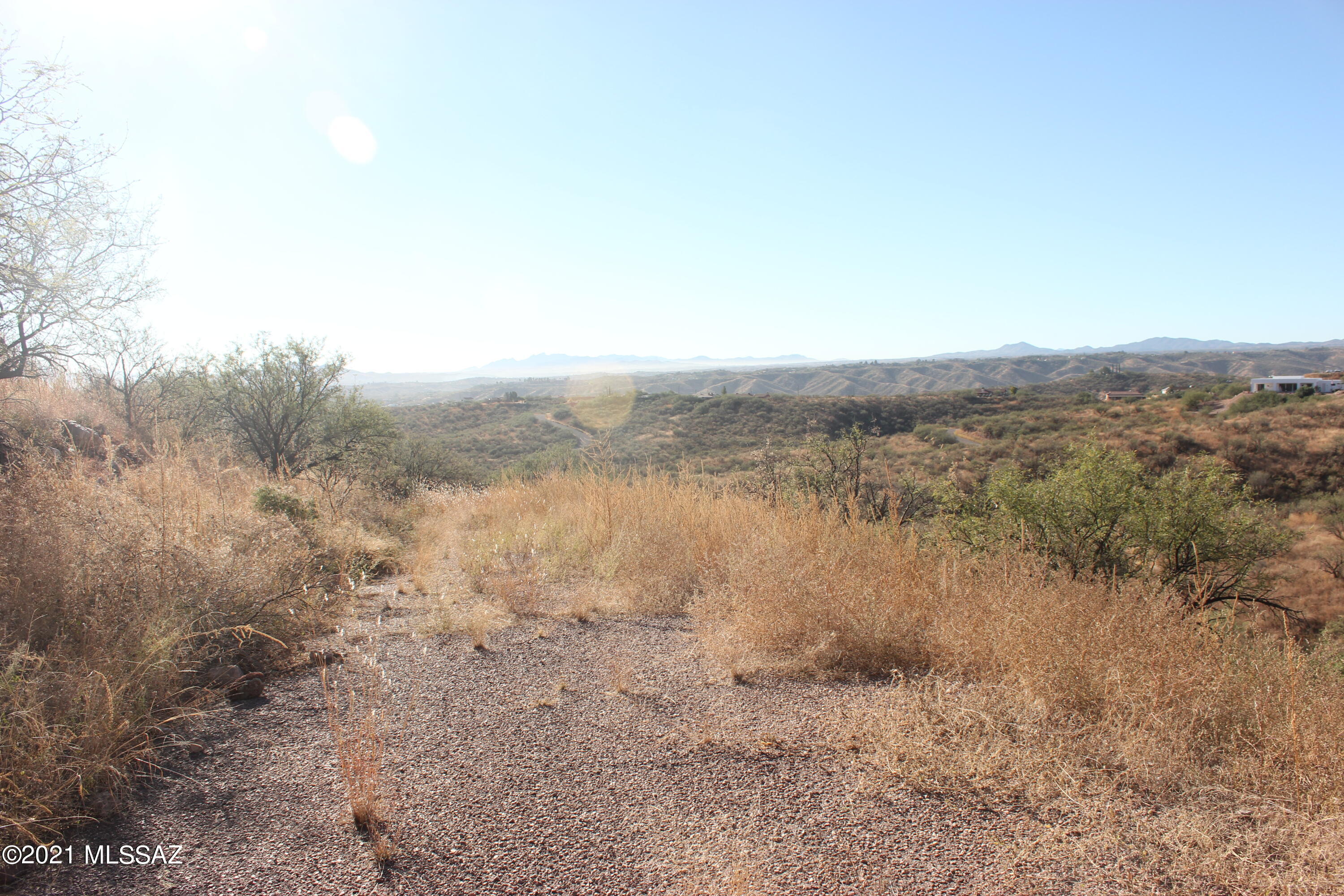 Residential lot with gentle slope.  Fantastic views.  This lot is on the corner of Goatee Lane and Camino Hombre de Oro and runs from Calle Cipres all the way to across from Via Patricia.  Electric poles are on Camino Hombre de Oro and water is probably there also. The seller does not know if any percolation test was ever done.