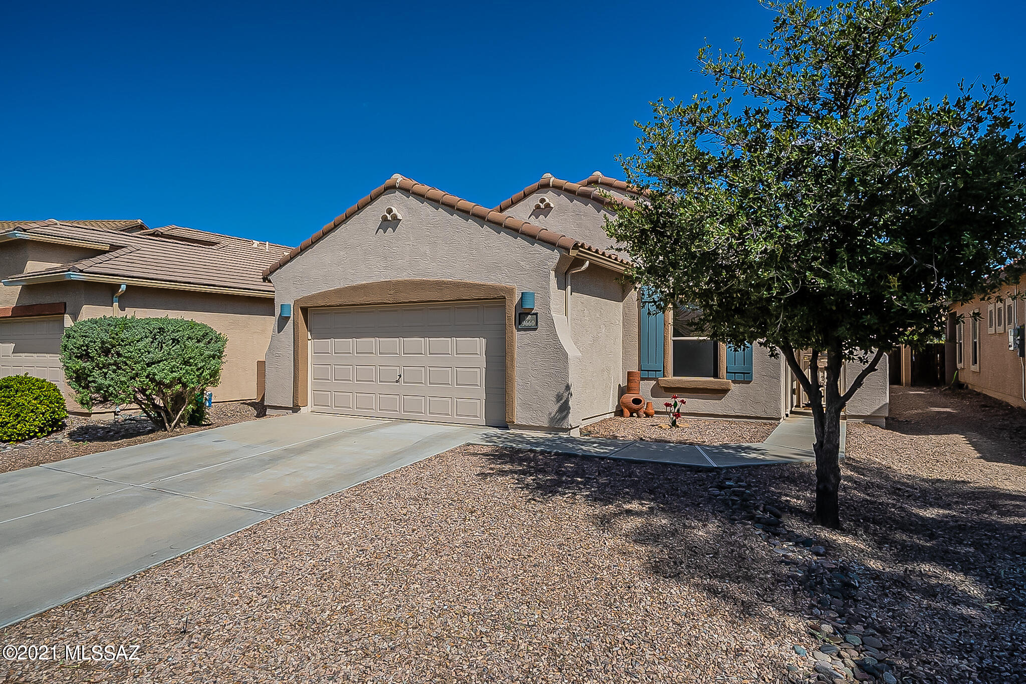 This beautiful single-story home is just minutes from I-10 access, soccer & ball fields, public library, river path & oodles of shopping & dining options. Continental Ranch has community pools, tennis, basketball, a skate park & more with an HOA fee of just $27/month! This gem of a home has an East-facing walled backyard with a covered porch, an extended patio & turf lawn for a wonderful entertaining area. The interior features an office with double doors, 3 bedrooms, 2 baths & large living room with a dining area. The home was professionally painted inside & out in 2021 & the high traffic areas have been updated with ceramic tile plank flooring. The bright, cheery eat-in kitchen has black appliances, soft grey cabinets, sleek white counters. For more about the area go to crcatucson.com.