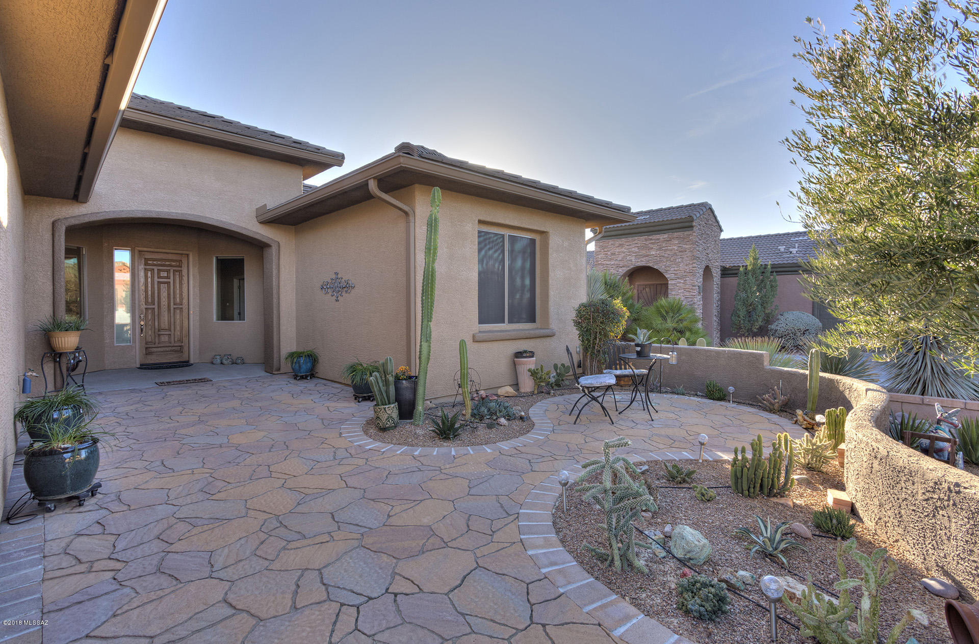 From the welcoming entry courtyard, you'll enter this wonderful 2Bd/2Ba + den home with open floor plan and wonderful back patio views of the Santa Rita Mountains.  Notice the honed-stone countertops in the kitchen and the granite on the bathroom vanities.   The spacious back yard is perfect for entertaining or just enjoying the peaceful views.  There is even a workshop area in the garage.  Stop by to see for yourself!