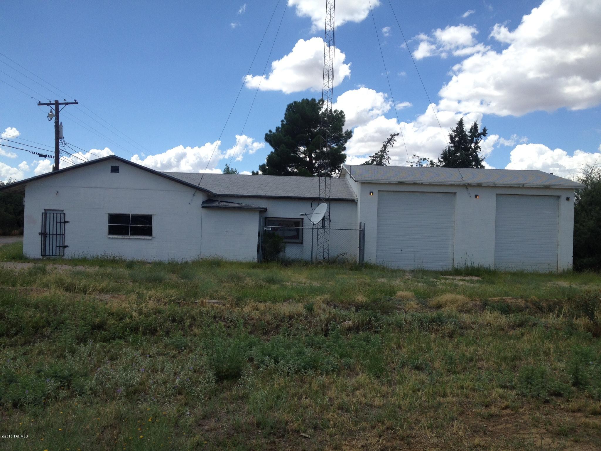 Previously used Fire Department Building.  Building has 4 large bays with 4 garage doors.  This lot is currently zoned GR but Fire Department is in the process of rezoning to commercial.  Talk with county to verify type of business. Current owner does not pay taxes because they are a non-profit organization. Building currently has 100 amp electrical service. Building sold AS IS.