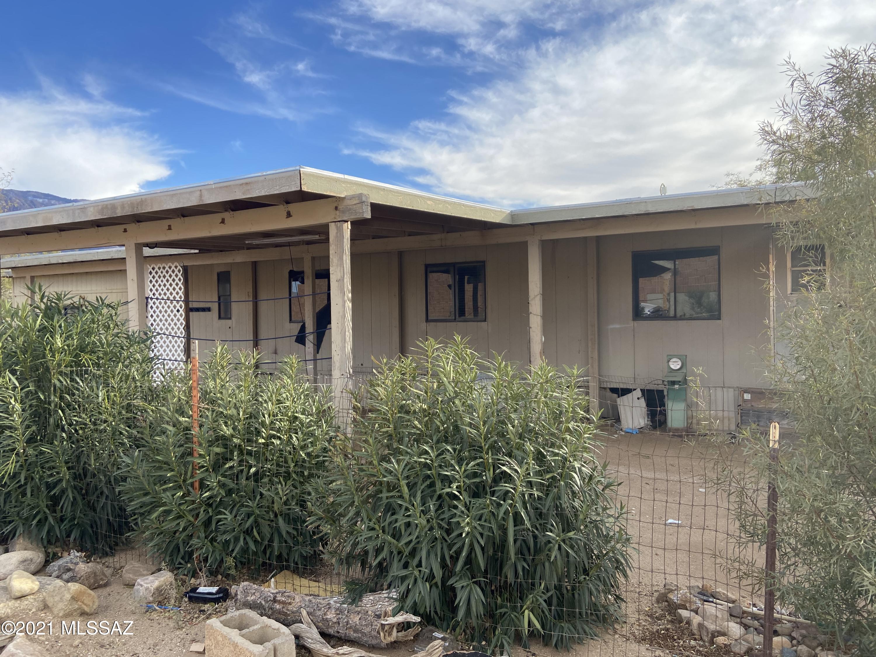 Calling all investors. Handyman special with a lot of work to get done. Fixup manufactured home with an attached addition building which makes it 4 bed 2bath. Large 1 acre lot with wonderful mountain view. Great location, second lot from the Lago Del Oro Pkwy. 
This home is to be sold AS-IS. Seller will make NO repairs. Listing agent is related to the seller