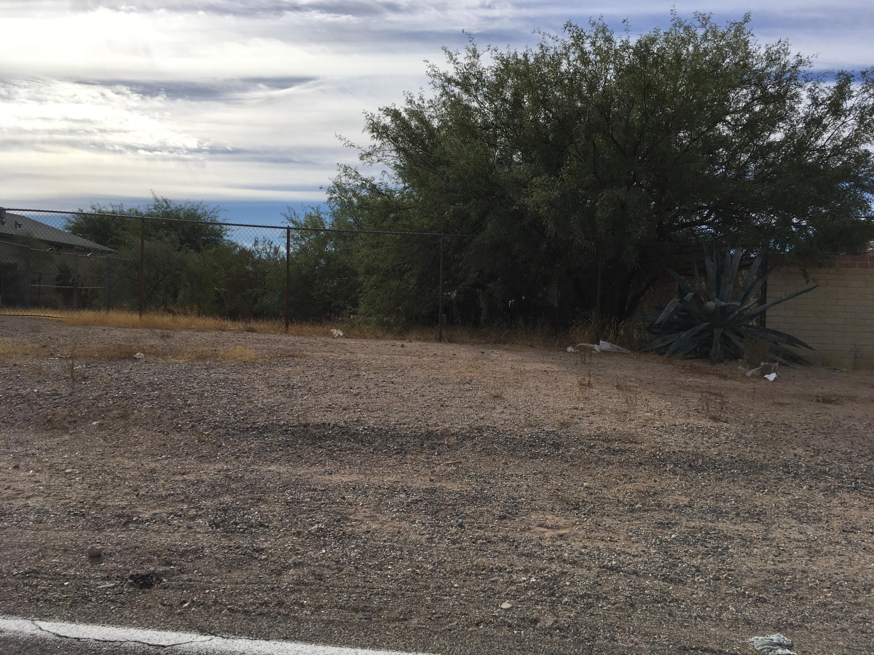 Small lot - totally fenced and gated - zoned residential - could be Tiny House?? Nicely situated property.