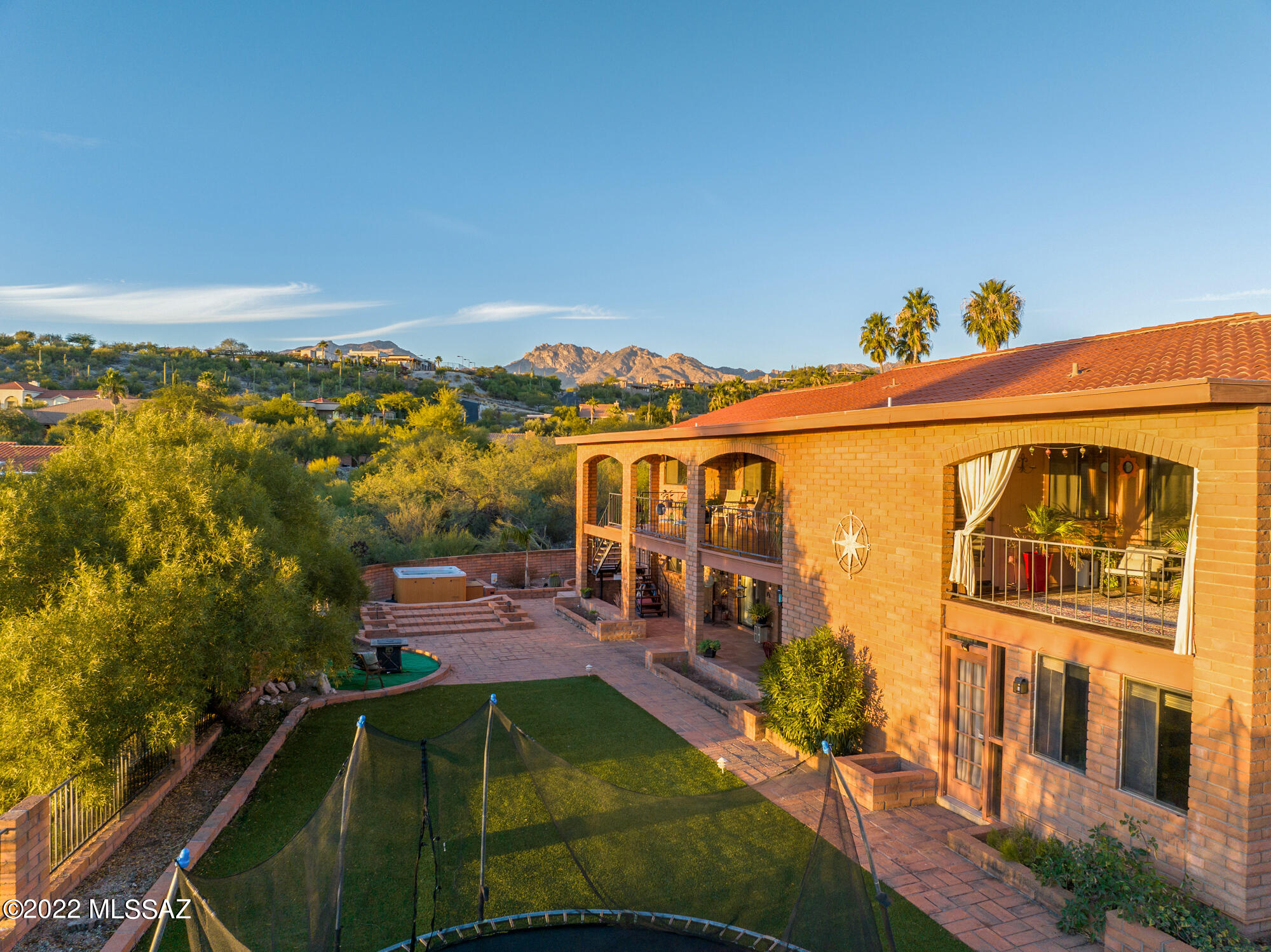 SELLER WILL OFFER CONCESSIONS TOWARDS INTEREST RATE BUYDOWN WITH ACCEPTED OFFER- GET LOW RATE DOWN TO 4.25%- ASK LISTING AGENT FOR MORE INFO!  Majestic Catalina Foothills territorial home sits on over an acre in desirable River Hills Estates. Enjoy unbelievable AZ sunsets and serene private desert views from the multiple balconies and covered patios this home offers. This completely remodeled home is perfect for multi-generational living with 2 primary suites and 2 bonus rooms currently being used as a gym/ library but can be used as 2 additional bedrooms for a total of 6 bedrooms. The main primary bedroom is located on entry level along with 2 additional bedrooms. Custom features throughout including FULL bar! No HOA! Backyard extends far out past the back wall.  Don't miss this gem!!