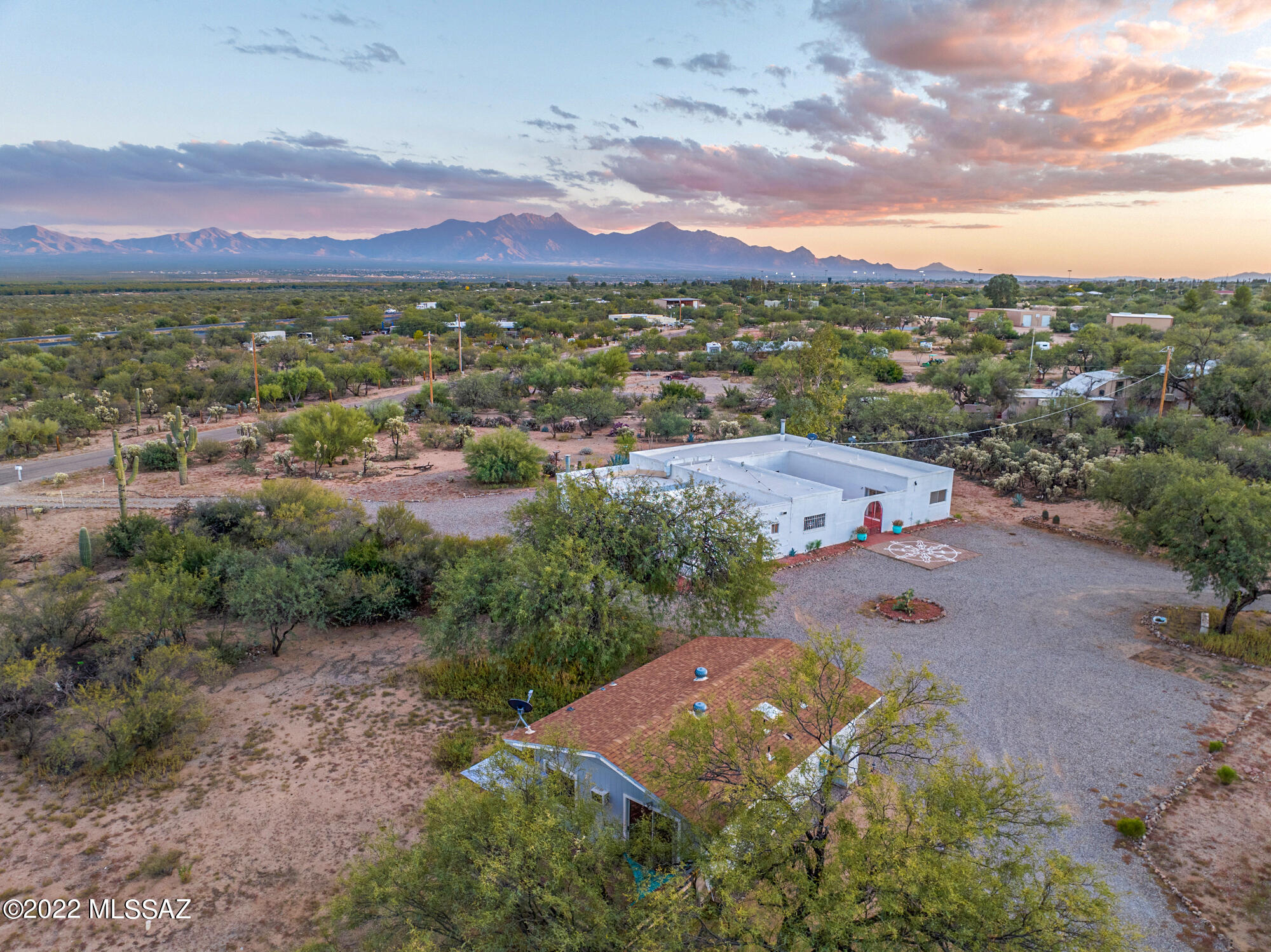 Amazing views and privacy on this Horse Property(by zoning on 3.55 acres, with NO HOA. Sellers are replacing windows and slider door in Main home! HVACs only 5 years old.2951 sqft home has 5 bedrooms plus office/den, 4 bathrooms. 3 bedrooms have on suite bathrooms!. The charming GUEST HOUSE (built 1995)  has been fully remodeled and has 1 bedroom, 1 bath, great room, with slider to backyard, and a laundry room with newer washer and dryer. The main home has a huge red brick Central Courtyard, Pine Beam Ceilings inside, 2 Fireplaces, Remodeled Kitchen. 470 sqft of new vinyl flooring still in unopened boxes can convey with the home to finish up some rooms similar to other rooms already finished.. Having been Licensed as a Assisted Care Home Facility in the past makes this an ideal multi family home or a business opportunity/income property. Washer and Dryer in Guest House is only a year old and can convey with the home.