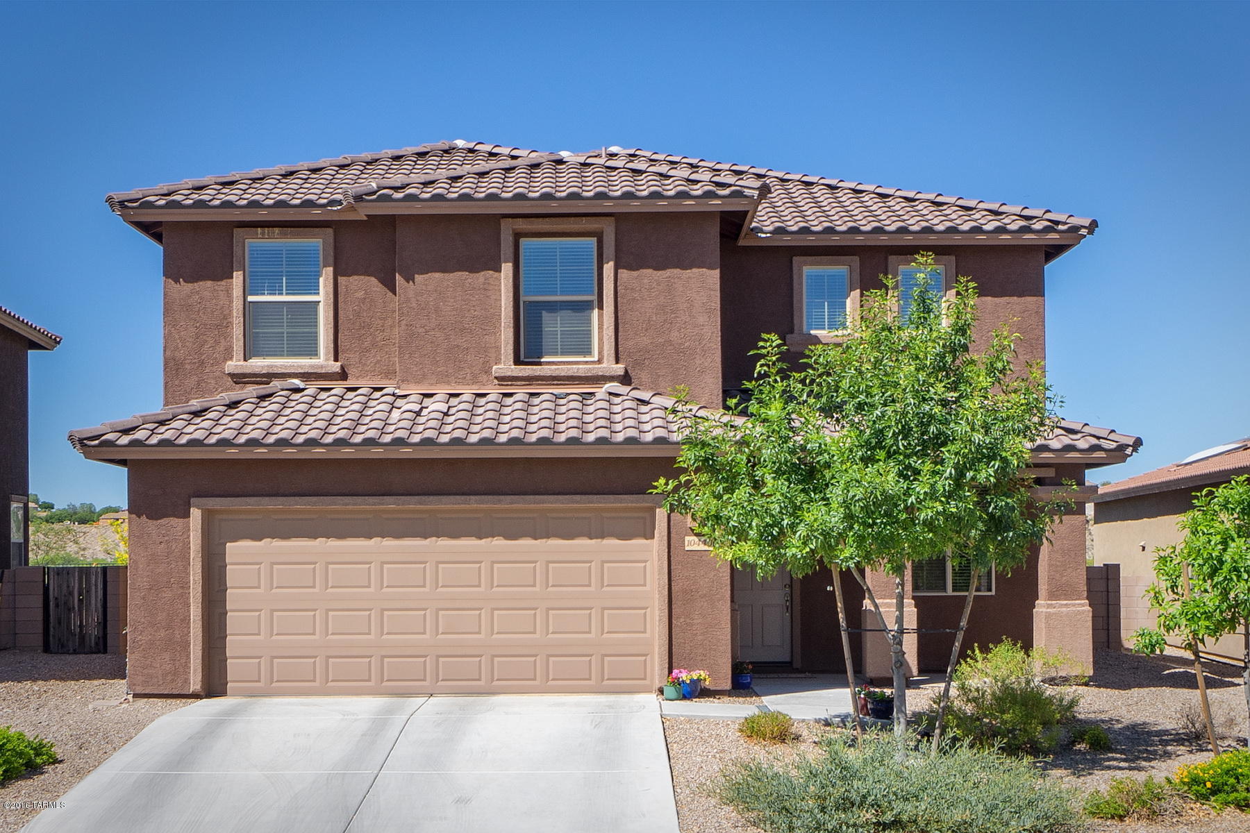 Enjoy this 5 bedroom, 3 bath, 2 story home that sits on a premium lot with common area behind it. Large kitchen with built in microwave, gas cooktop, breakfast bar and breakfast nook. Kitchen opens up to the large family room that looks out to the grassy backyard.  Downstairs also offers a separate living area and 1 bedroom & 1 full bath. Upstairs has a large loft with 3 additional guest rooms & 1 full bath and the master bedroom. Master bath has dual sinks, garden tub & shower with glass enclosure. Huge walk in closet that’s the size of a bedroom. Walking distance to the community pool which has Basketball court & playground.