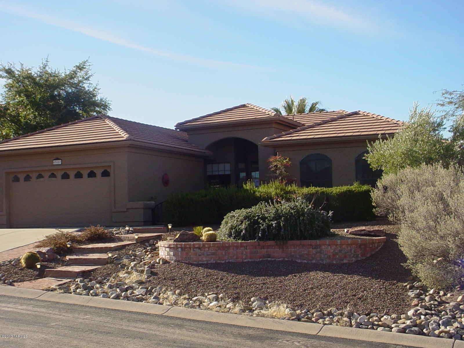 Beautiful and professional front landscaping leading to a front courtyard. Spacious living and dining room opens to a screened Arizona room. Kitchen features granite counters and abundant cabinetry. The master bedroom will accommodate large furniture. Pamper yourself in the garden tub or glass block enclosed shower. The den will make a great office or TV room. Outdoor living is designed to take advantage of the mountain and sunset views on the elevated seating area while listening to the soothing sounds of the pond/waterfall. Buyer to pay capital improvement HOA fee.