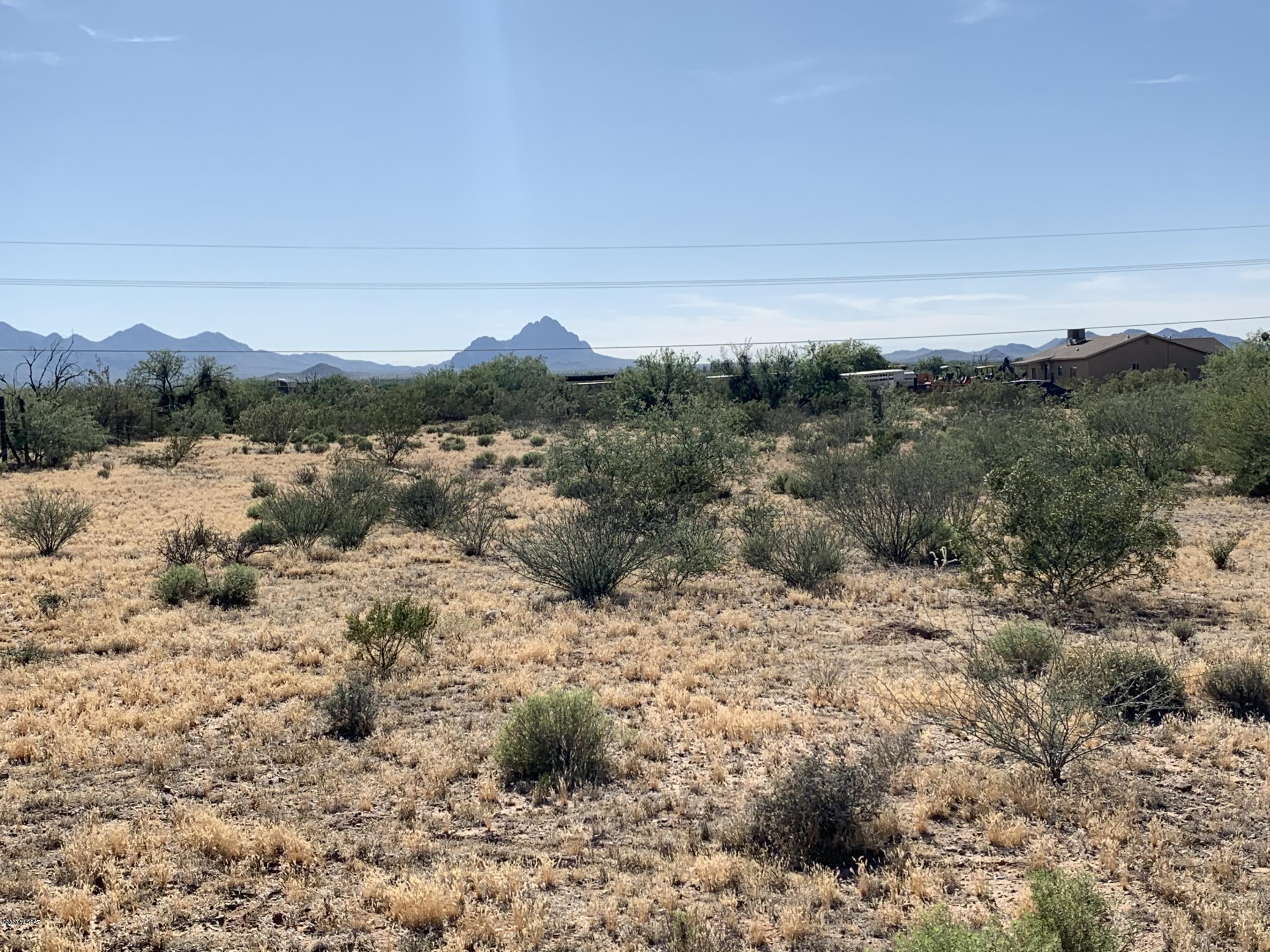 Easy flat  build, affordable acre on paved road with E/W orientation.  Front faces west, back faces west.   Great opportunity to set up a manufactured home and call it home.