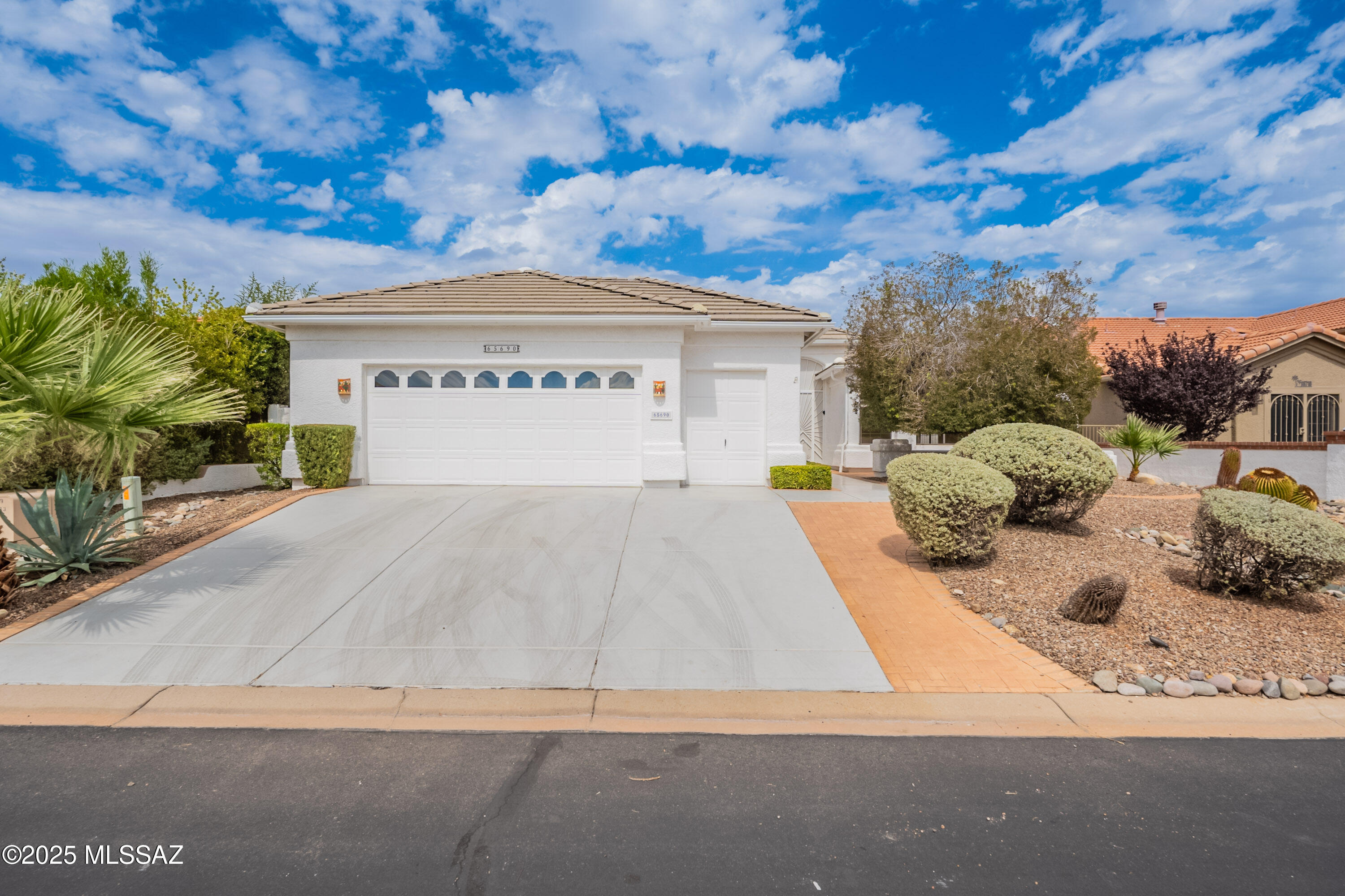 Great opportunity to own a beautiful property in Arizona's most sought-after active adult community. This roomy, single-story home is 2665 sq feet. It boasts a large living and formal dining area as you enter and a good-sized great room off the ample kitchen with a charming beehive fireplace. Freshly painted interior and brand-new stainless-steel appliances in the kitchen. The home sits on a large lot with tons of privacy. The backyard is a quiet oasis with mature landscaping and a charming water feature, built-in BBQ. It has a 2.5 car garage with built-in storage and a golf cart bay. So much to offer in this beautiful home that has been lovingly maintained by original owners.