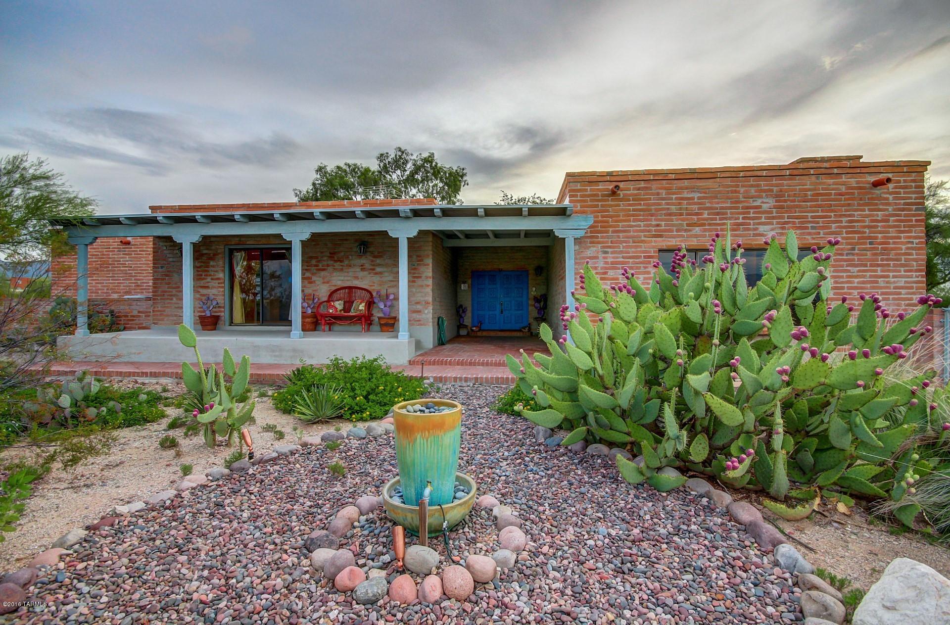 Spectacular Mountain and Sunset Views! Charming and well maintained home. Resting on over an acre in a quiet and private setting. Features High wood beam ceilings and exquisite Mexican Hand Painted Talavera throughout. Open and spacious kitchen with stainless steel appliances. Enjoy the cozy setting with your choice of 2 fireplaces in family room, or living room. Office room can be converted into a third bedroom. Relax in the Beautifully landscaped backyard with fountain, or Splash into the sparkling pool. A Must See! Come take a VIEW!