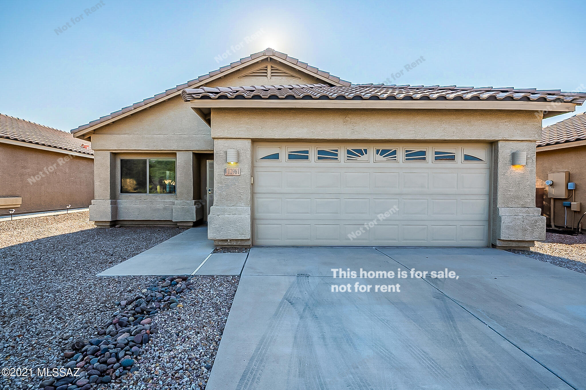 This Marana one-story home offers a two-car garage.