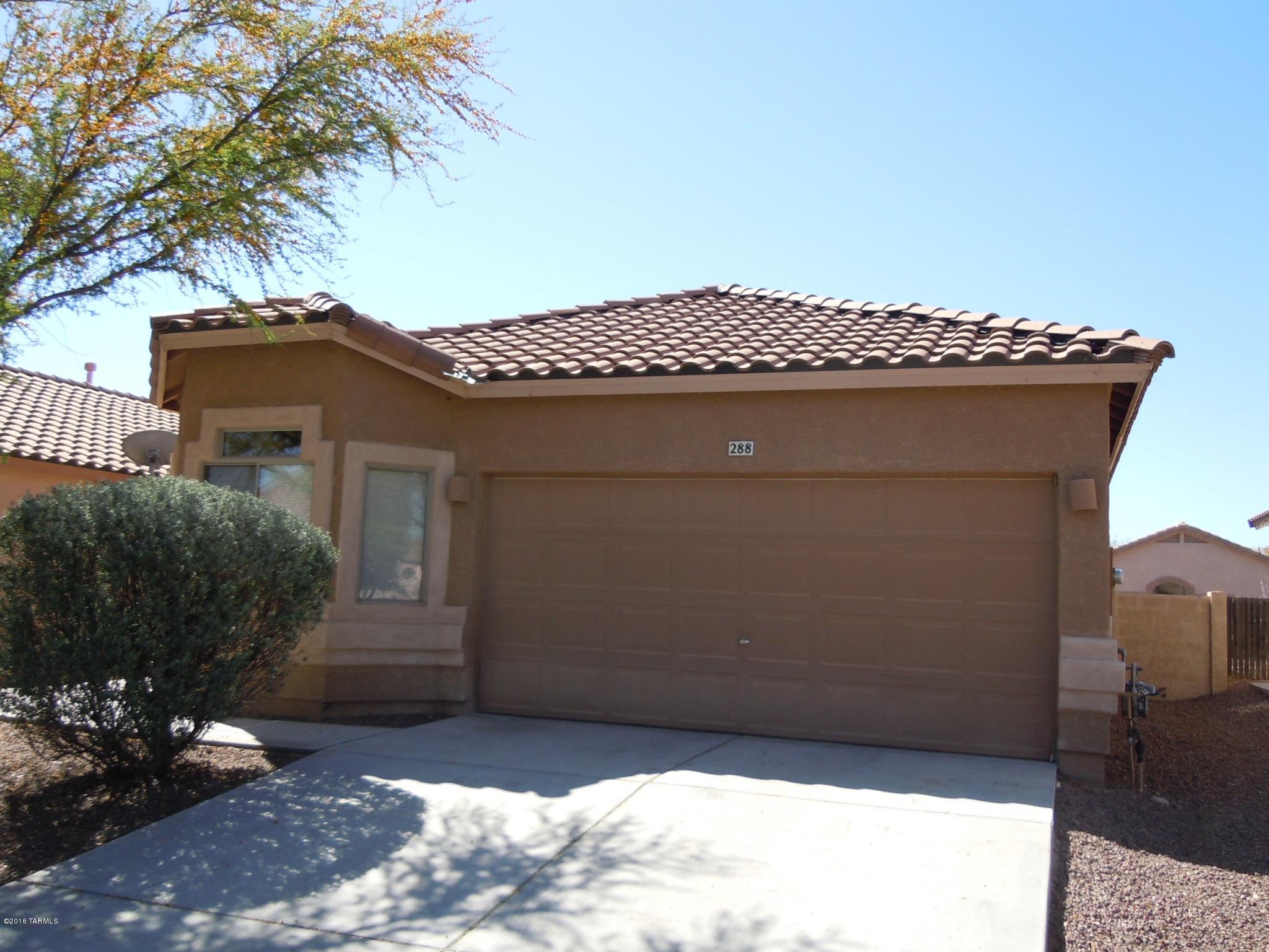 Private & Spacious 4 BDRM/2 BA Rancho Sahuarita stunner thats move in ready! Large 2-Car garage, Bay View windows in bedroom, New Carpet, New blinds. Plus a Big Open Kitchen with tons of Cabinets, large great room with vaulted ceilings and so much more. HUGE backyard. Just across the Street from the Neighborhood Park with Playground Area. This is as clean as they come in a highly sought after community with so much to offer! Enjoy the miles of walking/biking paths, the community rec facilities, kids splash pad, parks within minutes of high quality shopping and restaurants. This is the life you've been looking for!