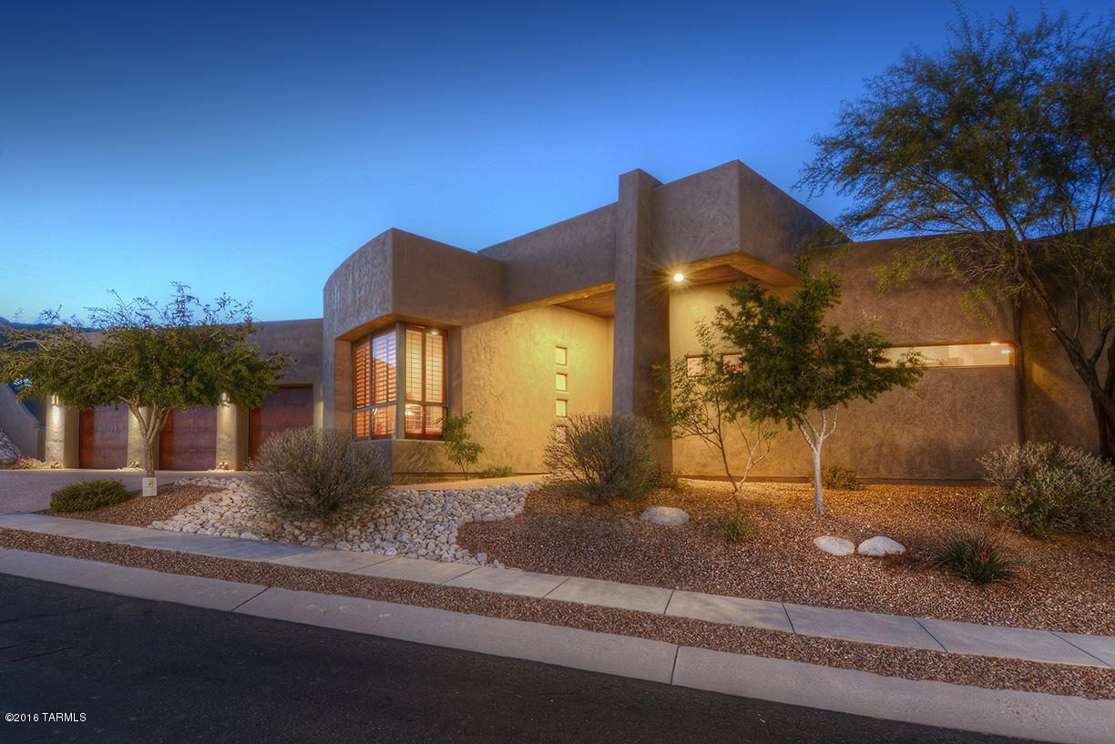 Beautiful 4 bedroom, 4 bath contemporary custom home with amazing vistas of Catalina Mountains and twinkling lights. Very private, behind 2 gates on Sabino Mountain. Beautiful copper 24x24 travertine floors, granite counters, stainless appliances, gas fireplace in master. Huge luxurious master bathroom with spacious walk-in closet. 2 other ensuite bedrooms and den/4th bedroom. High covered patio ceilings with wood to not obstruct the views. Enjoy lounging by the pool while watching the stars!