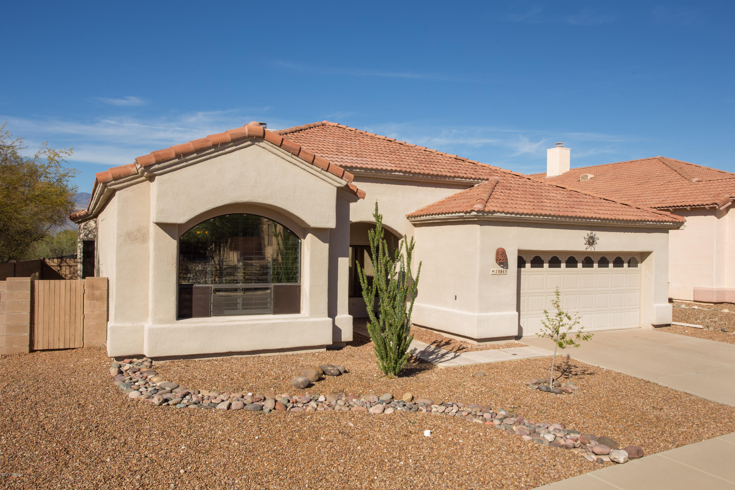 Beautiful move-in ready 4bd/2ba home in Silverado Hills subdivision with amazing Mountain Views.  Enjoy your coffee under the covered patio or Ramada as you enjoy tranquility and listen to the birds and wildlife. There is tile throughout the home except bedrooms, vaulted ceilings, ceiling fans in everyroom. The open kitchen has corian counters, double oven, under cabinet lighting and great mountain views. Cozy beehive fireplace in the family area.  Wake up to  beautiful mountain views from the master bedroom, master bath has shower and garden tub. The finished garage has upper storage and a utility sink. No PB plumbing in this immaculate home.