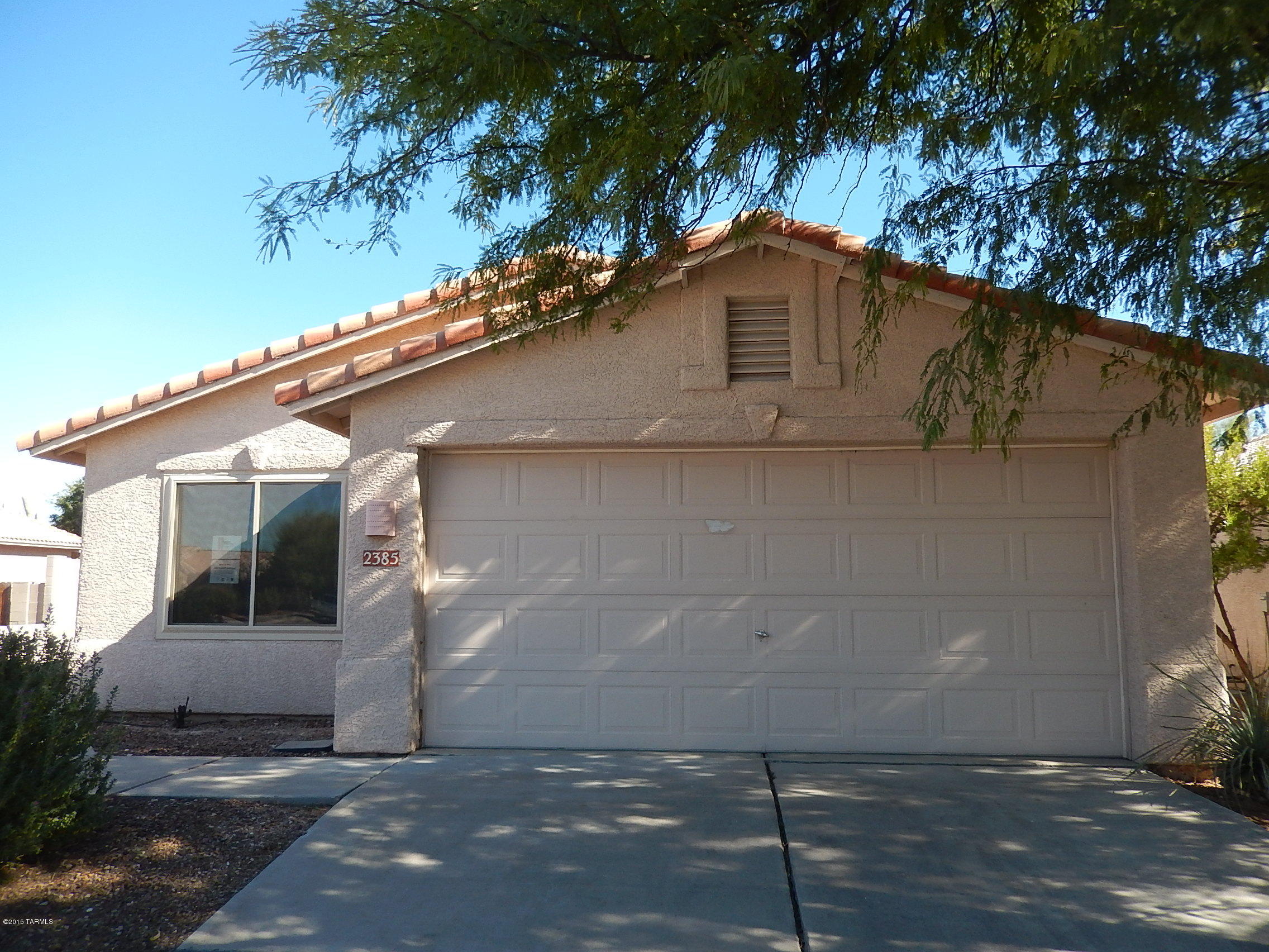 HomePath Property - Beauty with great room floor plan and vaulted ceilings, makes this 3 bedroom, 2 bath home seem much larger than the actual square footage. Spacious kitchen, double sinks and walk in closet in master bath/bedroom are just a little of what this home has. New decorator paint throughout. No neighbors to the rear.  Close to good shopping, bus line and Davis Monthan Air Force Base. Special HomePath First Time Homebuyer Program with 3% closing costs available to qualified buyers (see attached flyer for details).