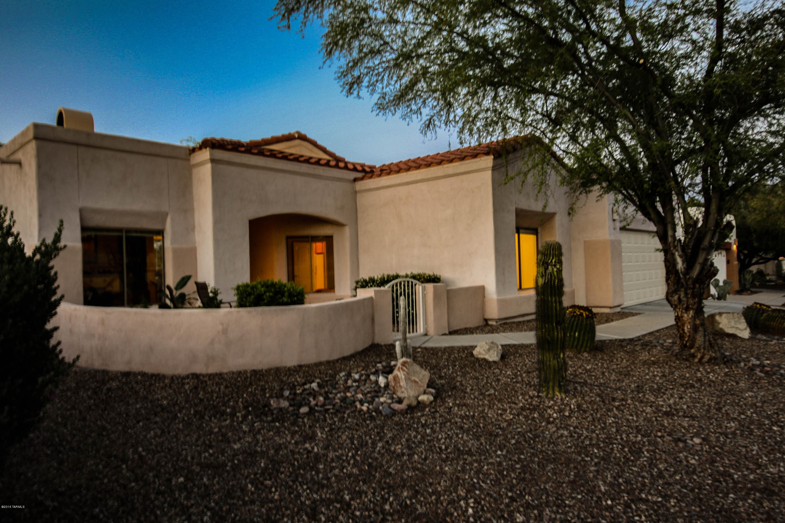 A Happy Home to make your own! Close to everything including high ranking schools, shopping, cinema, jogging paths, Naranja Park, Oro Valley Hospital and more. Popular great room floorplan with small den or formal living room. Gas fireplace adds to the charm of this lovely home. New carpet throughout! Mature landscaping with calming fountain in the backyard. Take in the lovely Catalinas from the sitting area of your own front courtyard. This home is ready to go and won't last long. Come and see for yourself!