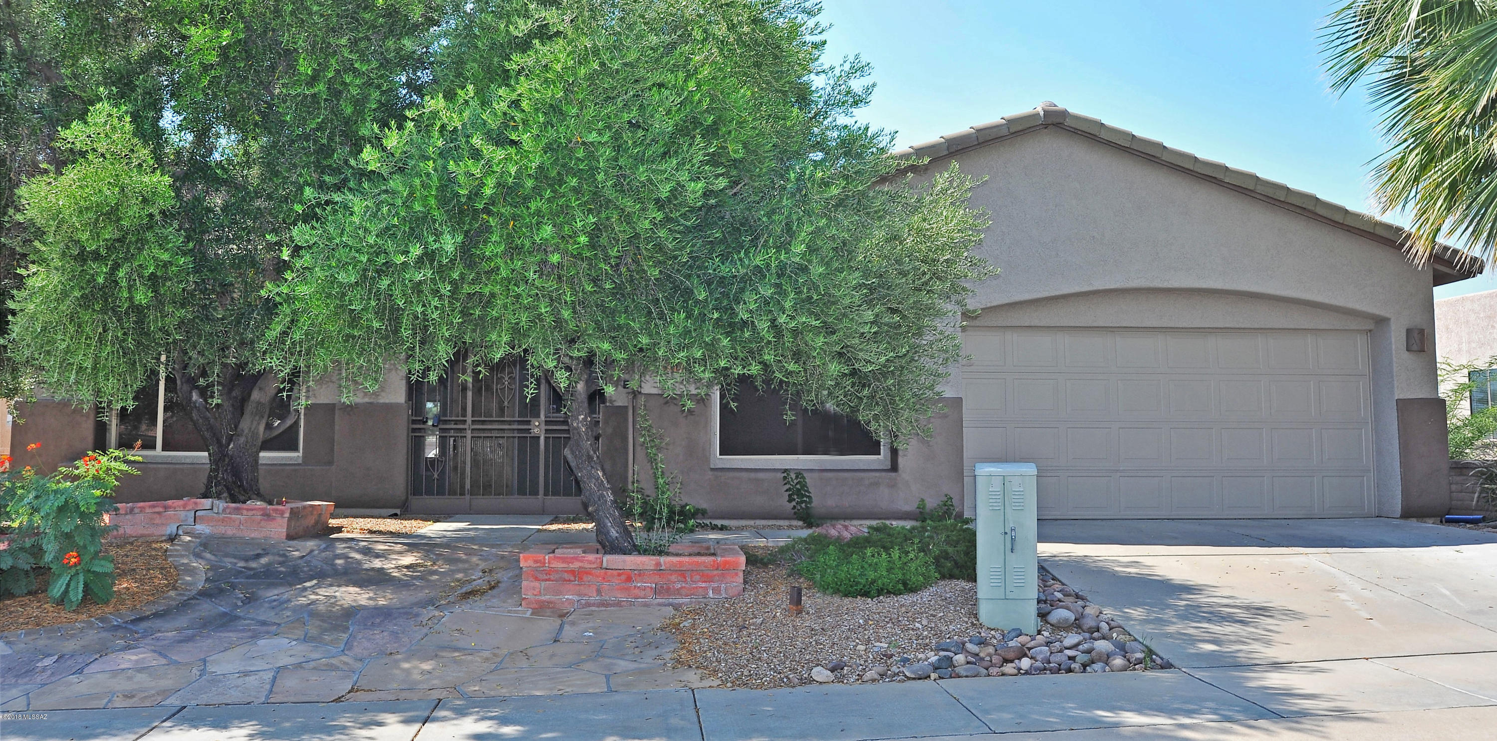 This home has many perfect remodeled features and amazing mountain views. Great open floor plan with 2 bedrooms and a den/office. All new flooring throughout including high quality tile in living areas and carpet in bedrooms. All new interior paint. Large gourmet kitchen with upgraded cherry cab's and granite counters. Granite Island w/ Bar seating for two. Gas range and built in microwave, Side by Side refrigerator with ice/water dispenser.  Huge family room with gas fireplace and sliding glass doors affording a great view of mountains. Plantation shutters throughout. Master suite has a garden tub, dual sinks and a walk-in shower. Laundry room has upper cabinetry. Oversized covered patio with an extended flagstone patio and roll down shades. Outdoor fireplace and banco seating.