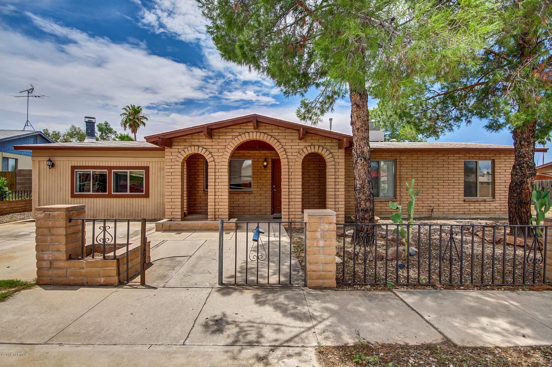 Gorgeous 3 bedroom 2 bath family home! Updated and freshly painted. Features open kitchen with tiled counter tops, granite sink, ample cabinet space and pantry. Tile flooring throughout the home. Large family room with a beautiful brick fireplace for those chilly Arizona nights. Huge backyard with covered patio, custom firepit, and room for a pool. Home is like new! Come take a view!