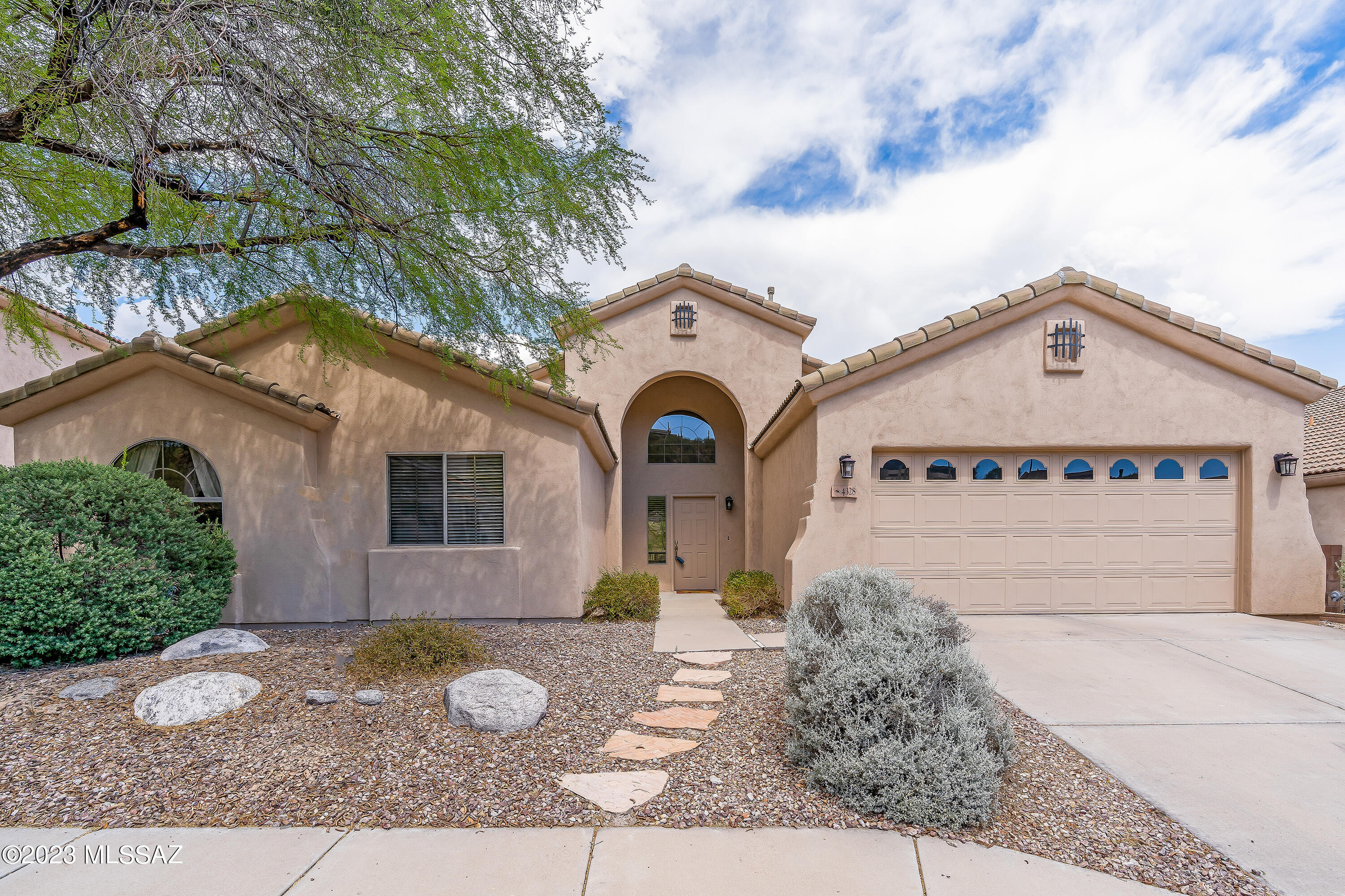 Stunning hiill side lot with Mountain views and mature landscaping nestled in this gated Sabino Mountain Community.  Community Pool, Views of majestic sahuaros and ocotillos.  Soaring vaulted ceilings, large windows for natural light w an open and airy layout. Spacious great room with a cozy fireplace, and built in shelving components. The kitchen is like new with granite countertops w stainless steel appliances, pantry and center island. Escape to the master suite and bonus room or den/office. exercise room. Tile floors, fresh paint ,new carpet, new water heater. 2 car garage. Tranquil covered patio and yard with mountain views.  Perfect place to call home.