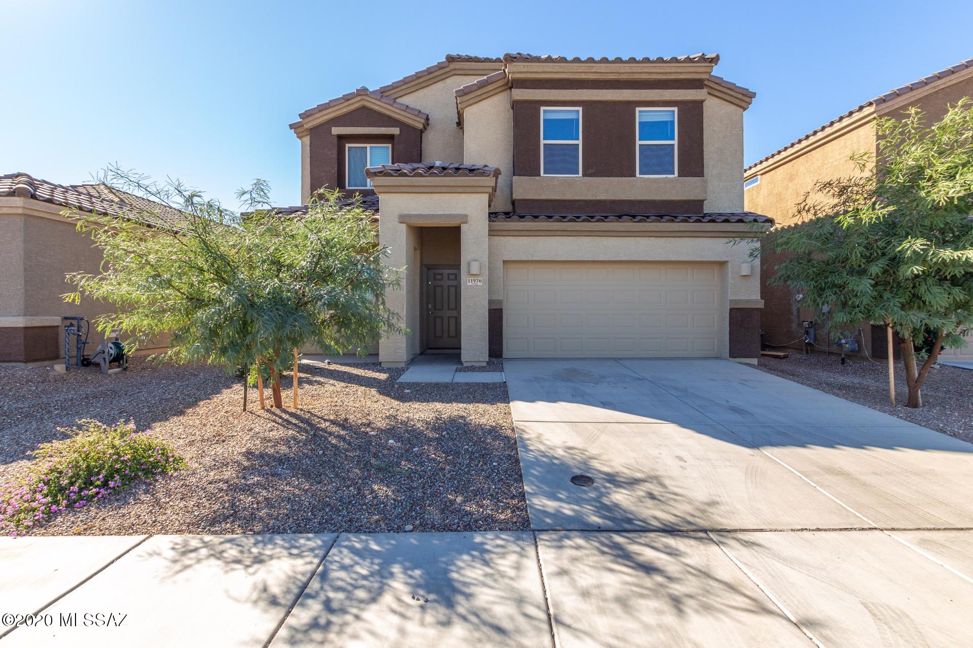 Gorgeous two story home w/a warm & welcoming palette, beautiful tile floors, upgraded lighting, ceiling fans, & window blinds. Center kitchen island, granite counters, breakfast bar, pantry, SS appliances, & handsome wood cabinets w/crown moulding. Patio access from dining area. Guest bedroom & bath on first level w/a den. Amazing loft area w/endless possibilities. Grand master retreat boasts a private en suite w/dual sinks & a walk-in closet. Plush carpet in all the right places, ample closets, 3 pristine baths, & interior laundry room. The huge backyard offers a covered patio & is waiting for your personal touch! This incredible home will not disappoint!