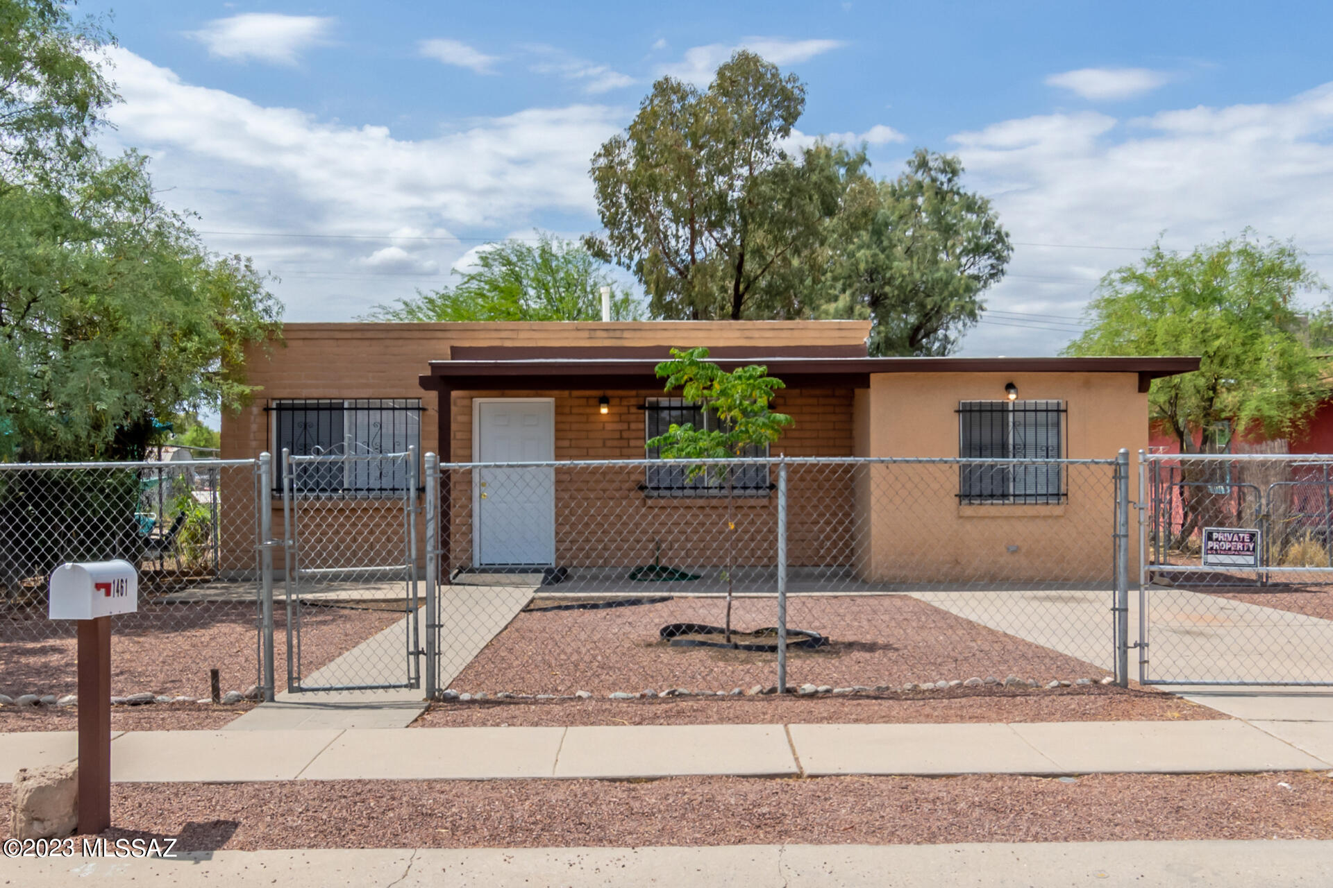Historic and highly desirable Barrio Hollywood. Make yourself at home in this fully-fenced property with an excellent location! Lovely curb appeal w/a low-care front yard, a parking space, and a delightful porch to enjoy your morning coffee. Be welcomed by the inviting living room, showcasing a decorative ceiling fan, tall ceilings, trending palette, archways, and tile throughout. The eat-in kitchen showcases stainless steel appliances, ample wood cabinetry, and enough counter space for all your cooking needs. Unwind in the perfectly-sized bedrooms, one with a walk-in closet, after a hard day's work. You'll love hosting fun gatherings in the spacious backyard with swaying tall trees! Minutes away from shopping, dining, and more. What are you waiting for?