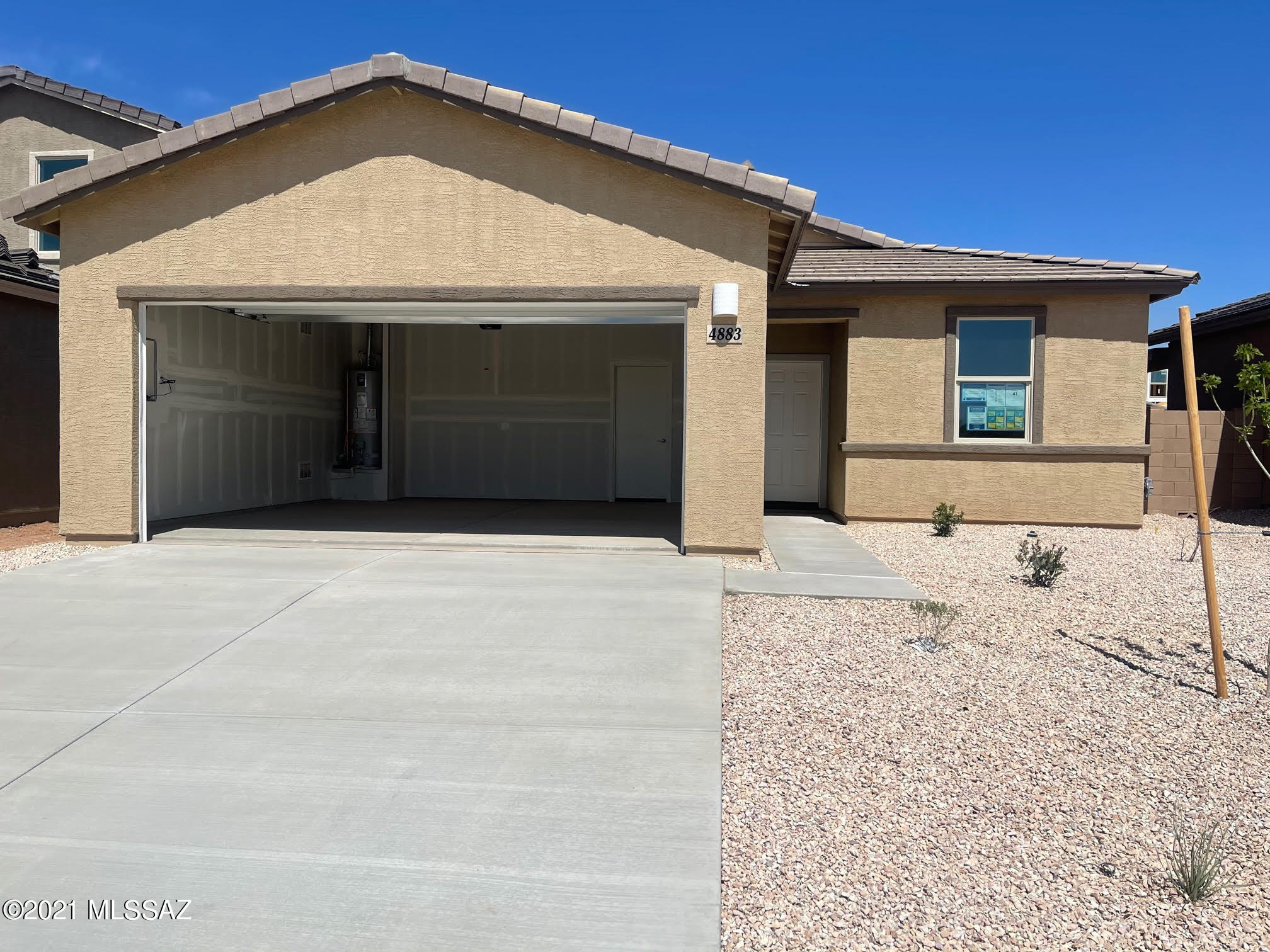 This beautiful NEW one-story home is bright and airy. It includes a breakfast bar, brand new appliances, energy-efficient windows, bull nose corners, paneled doors, recessed lighting, upgraded granite counter tops, and ceramic tile flooring.  Laundry room located inside with hookups, covered porch, patio wall, private back yard, attached 2-car garage, air-conditioning and, the best interior wiring for fast internet. Close to I-10, new shopping centers, and the Tucson Airport. $45.00 application fee. Tenant pays for utilities. No pets and no smoking.