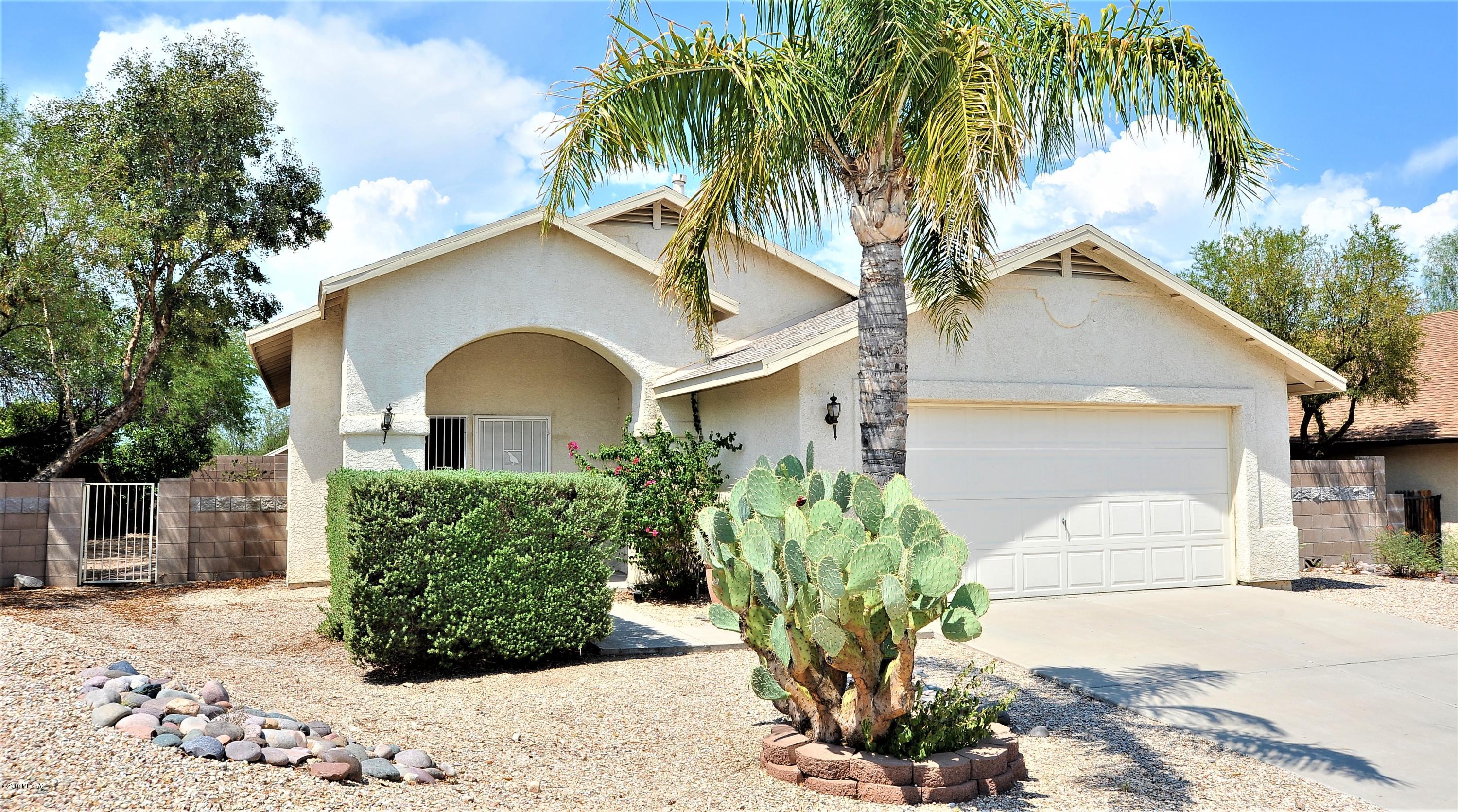 Very popular westside home is located on a cul-d-sac street. NO POLY PIPES and New Roof. Kitchen is spacious with newly painted cabinets, stainless steel appliances which include built in microwave, range, dishwasher and refrigerator.  Pantry and eat in kitchen.  The sliding glass door leads to the yard with a full length of home covered patio and an extended brick paver patio. Block wall and very large side yard.  Great curb appeal with front covered porch and a security wrought iron door. High ceilings, ceiling fans.  Interior freshly painted. Laundry room which includes washer and dryer. New water heater. 2 car garage. Close to downtown, I-10, restaurants, shopping, Pima Community College and the University of Arizona.