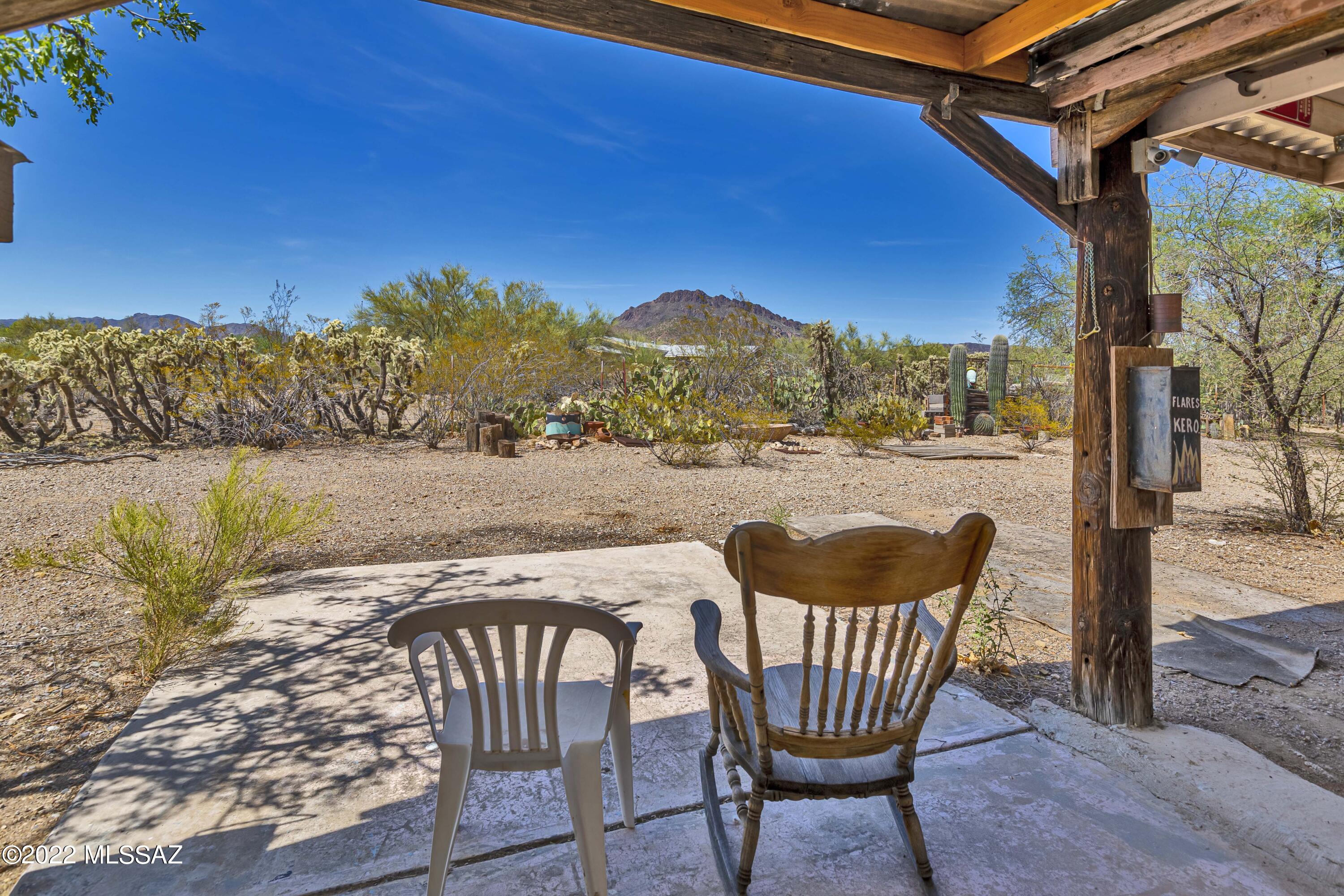 Private location with mountain views. Mature trees,  lots of birds, enjoy a walk on the path way through the beautiful vegetation, enjoy the metal and wall sculptures and cross the bridge  as you make your way back to the the covered front porch. Horse property, 2 chicken coops, one was used for a green house. 16x20 garage, 3 carports 2 sheds.