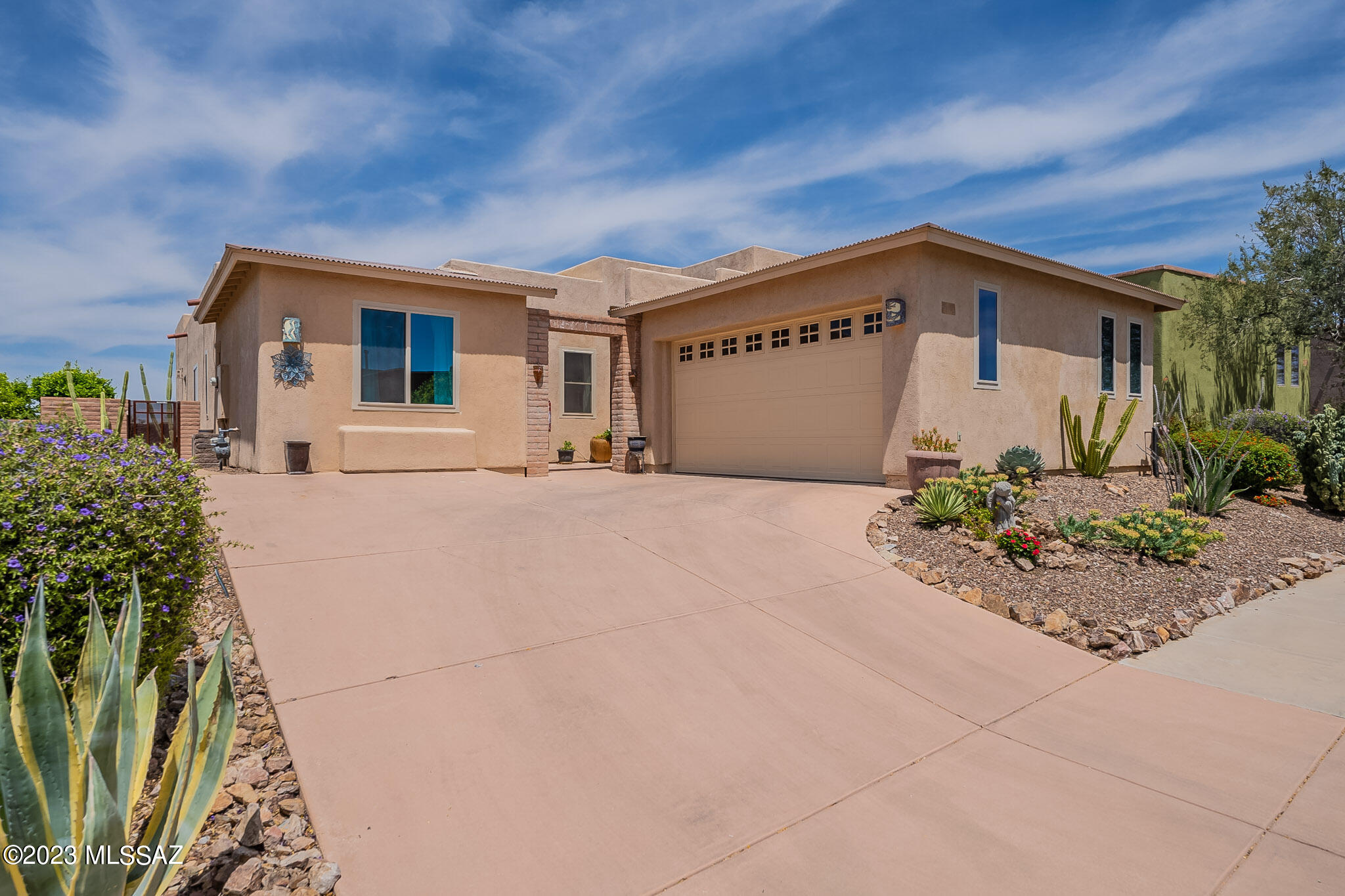 This beautiful home is located in the very desirable Skyranch subdivision. Located on a truly premium lot with no homes behind it.  It features a custom pebble tec pool with water feature and a covered patio with remote shades, as well.  Inside has Vaulted ceilings and 8ft. doors, travertine floors, granite counter tops and amazing finishes.  The home was modified to be nearly 2500 sq. ft. and has 3 bedrooms and 2 full baths, plus a large office/den with double doors.  A HUGE walk in pantry and oversized laundry room, as well.  There are 2 fireplaces both in the great room and the master bedroom.  The owner is also selling the home fully furnished with high end furniture. Truly turn key property.  A must see!!!!