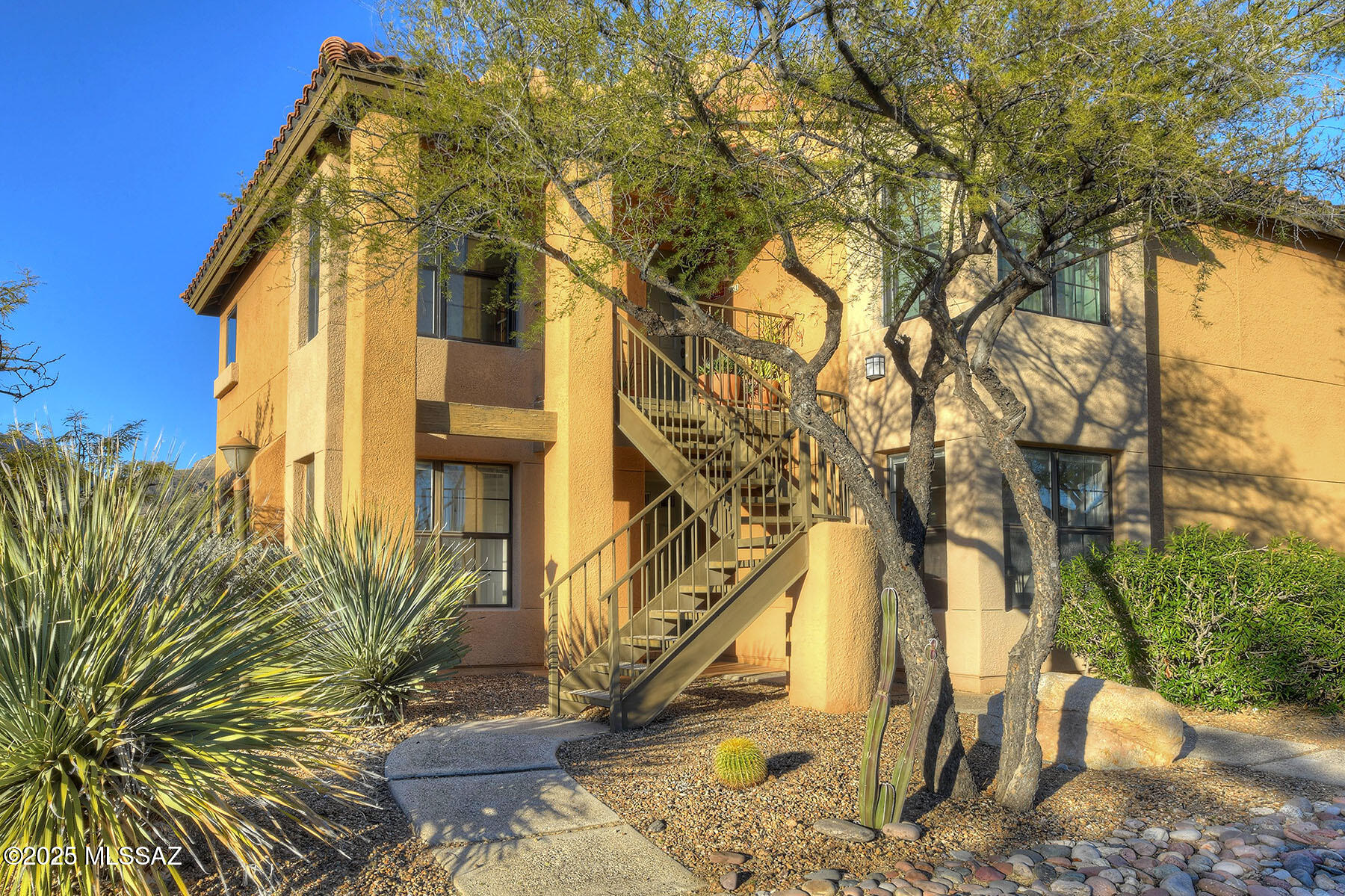 Welcome to your new home, where unpacking feels more like moving into a vacation! This fully furnished, move-in-ready 2-bedroom, 1-bath condo is a dream come true. The first-floor corner unit offers mountain and sunset views that'll make you wonder why you didn't move to Tucson sooner. Fresh paint, new carpet, and all-new furnishings mean you can just bring your toothbrush (and clothes, of course!).
Located in the heart of the foothills, you're steps from La Encantada Mall, dining, and hiking. Relax by the wood-burning fireplace or enjoy the views from your covered back patio.

With a fully equipped kitchen, high-speed internet, TVs, and resort-style amenities like tennis, pool, spa, and fitness center, this is Tucson living at its finest. Don't miss out! Owner/Agent.