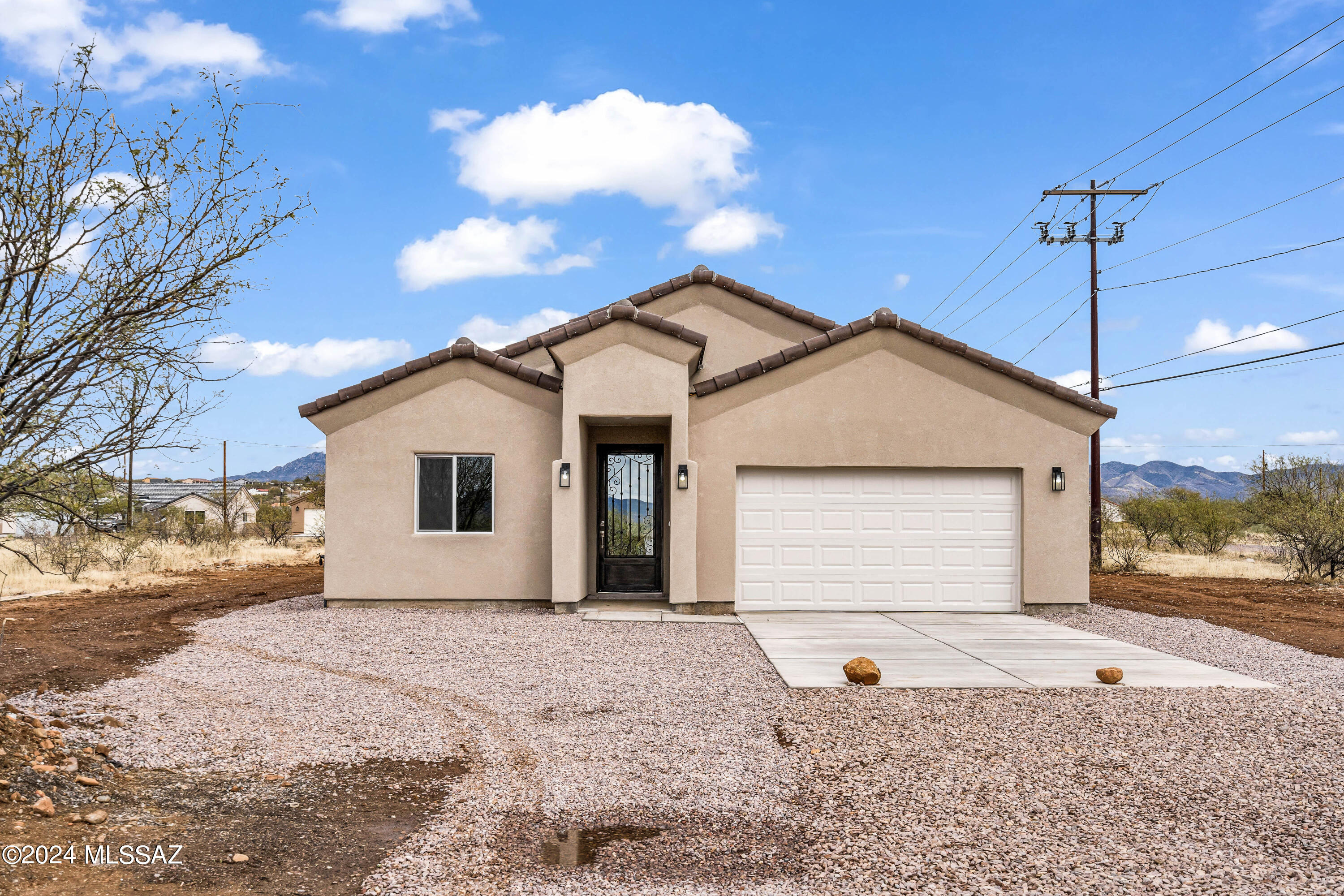 Newly built modern style home in Rio Rico, AZ with beautiful mountain views! This home consist of 3 bedrooms, 2 full bathrooms. Enjoy the spacious kitchen equipped with stainless steel appliances, granite countertops, 42in kitchen cabinets, and substantial island. Features of this 1664 sq. ft. home include ceramic tile floors, vaulted ceilings and spacious laundry room.
