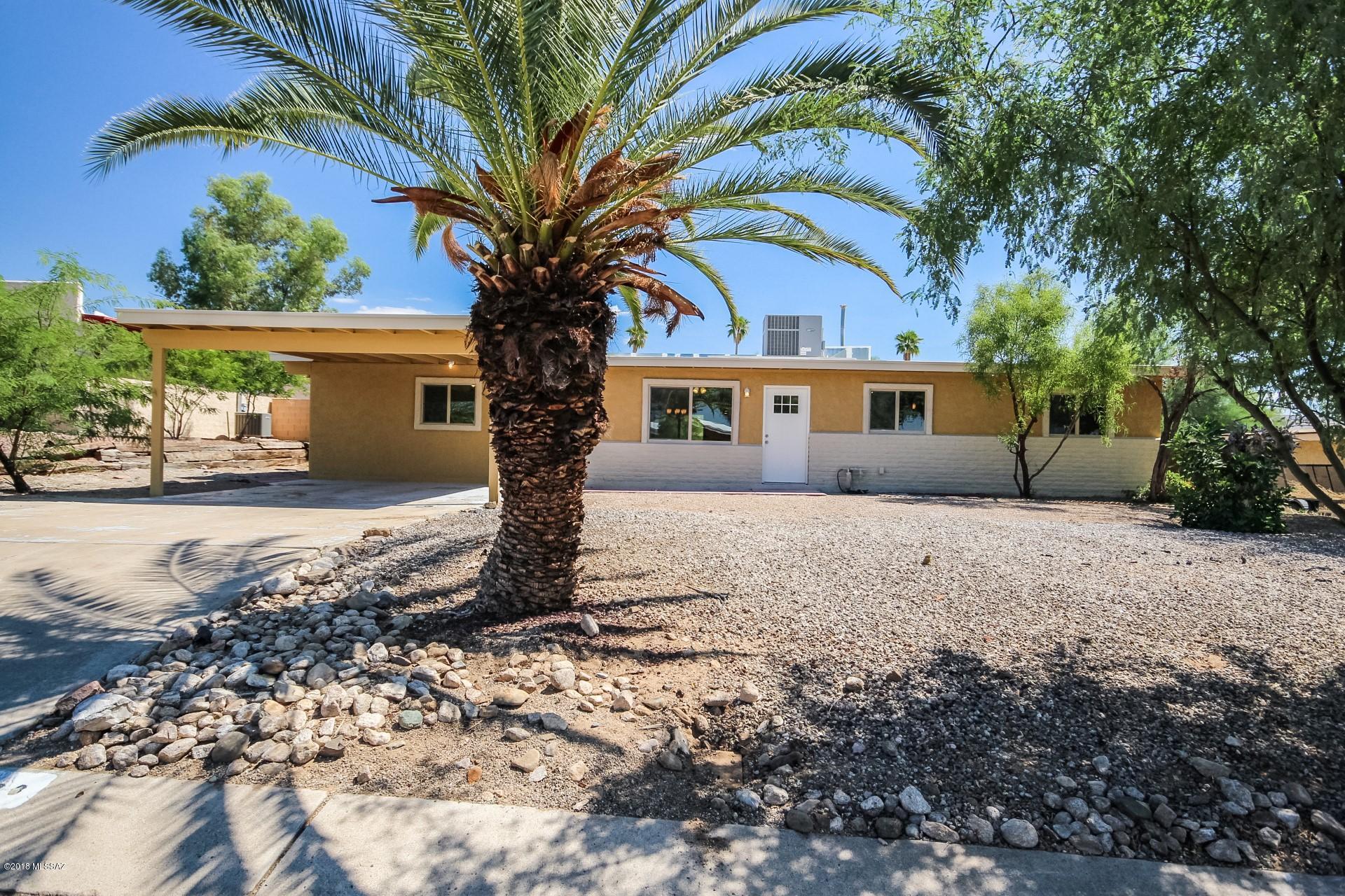 Home offered at range pricing of $189,900- $194,900. Beautifully Remodeled Ranch Style Home boasts stylish kitchen counters, center island, breakfast bar, and plethora of white wood cabinetry. Create a feast with family and friends. Stunning 12x24 plank tile floor, upgraded lighting, ceiling fans, soothing palette, and patio access from dining area. Plush new carpet/padding in all bedrooms, ample closets, lots of natural light,  2 upscale baths with designer tile, fixtures, and cabinets.  Large backyard offers covered patio, lush foliage, and room for a pool & garden. Close to Interstate, Shopping, & more. NO HOA. Owner/Agent.