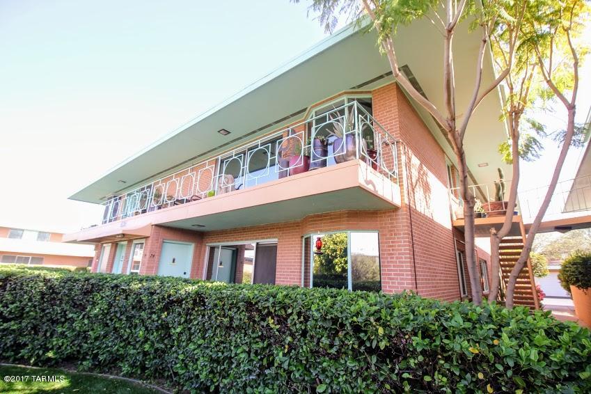 Gorgeously remodeled condo in Tucson's premier mid-century 55+ community. Situated perfectly within the Villa Catalina Apts, this unit has been lovingly remodeled with taste & style, AND for handicap accessiblity!  Widened doorways, safety bars in showers, a nice low granite countertop in the kitchen, with lovely wood floors, all freshly painted with designer colors. Lushest most lovely landscaping in town! Don't let the HOA alarm you. Homeowners get so very much for this monthly fee: it pays electric, HVAC & heat, water, taxes, garbage collection, gorgeous grounds and pool, and reserves. Cable will be your only bill! Front, back, and side patios are sweet. Truly carefree living!  Note:  only certified companion/therapy dogs are permitted.