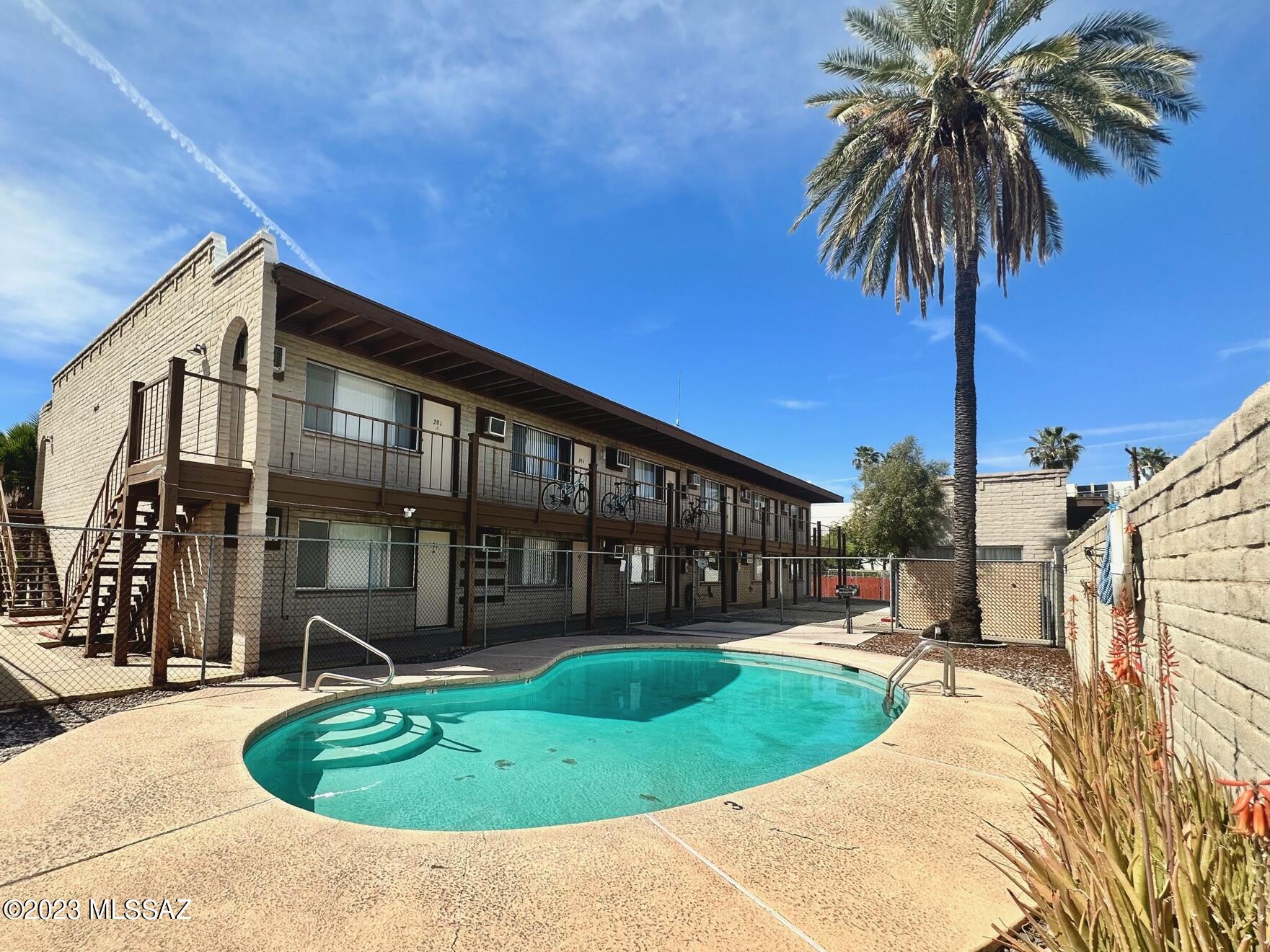 Located just two city blocks south of the University of Arizona, this 24 unit apartment complex features paved parking, on-site laundry, and a pool. Each studio offers a full bathroom with neutral Tub/Shower, spacious closet, and wall heating and a/c. Well maintained grounds and walking distance to the university campus, restaurants, and athletic facilities.