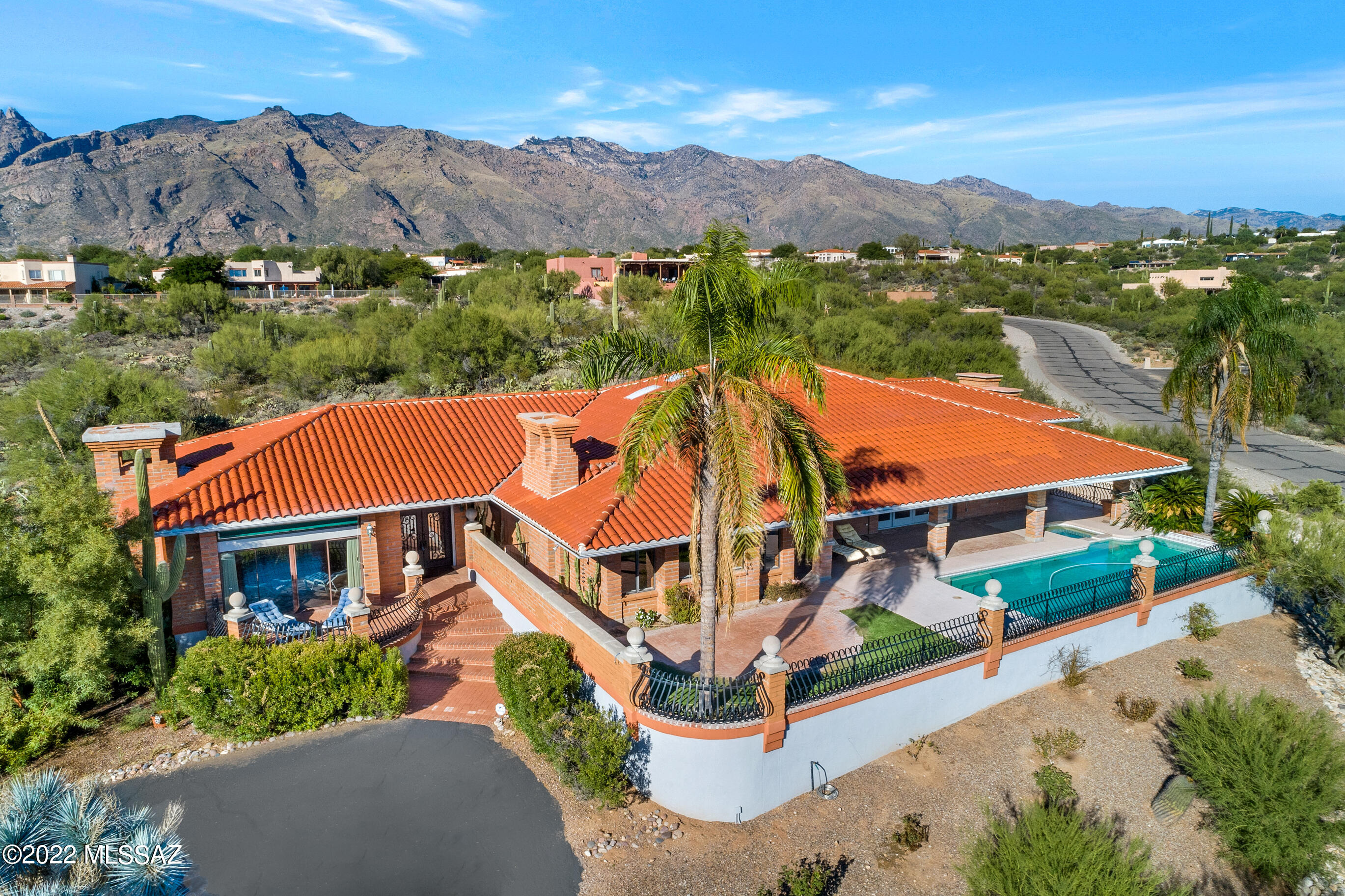 Views! Panoramic Mountain & City Views from Custom Foothills Home on 1.4 Acres.
Enjoy the City Views from the large covered patio overlooking tranquil pool in your own private desert retreat.  Gallery Hall leads to oversized rooms & large guest bedrooms complete w/private baths & walk-in closets.  Master bath with custom vanity, walk-in tub, and floor to ceiling mirrors.  Large family Room/Kitchen combo with fireplace and granite countertops.  Minutes from everything Tucson has to offer.